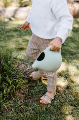 Close up of boy holding watering can