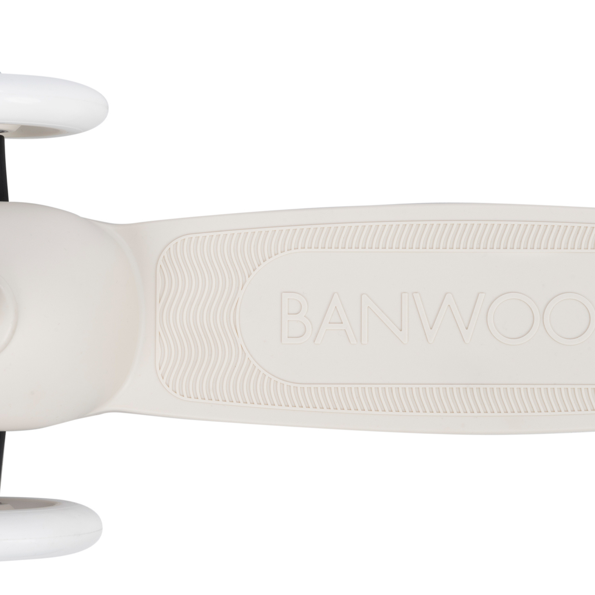 Close-up of the Banwood - Eco Scooter Ivory's recycled plastic footrest, textured for grip, with "BANWOOD" embossed at the center and partially visible wheel edges.