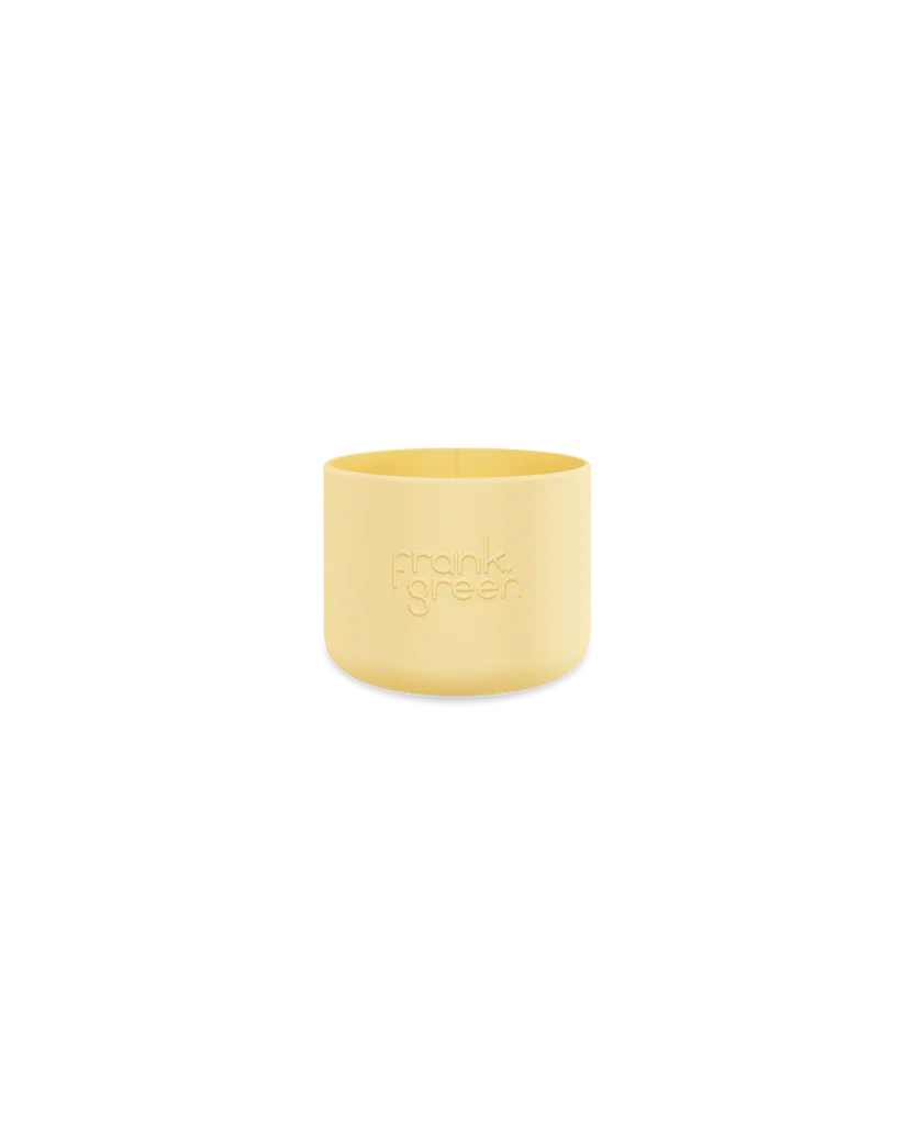 A Bottle Bumper Guard Small Buttermilk, designed for reusable cups, showcases the embossed FRANK GREEN logo on a plain black background.