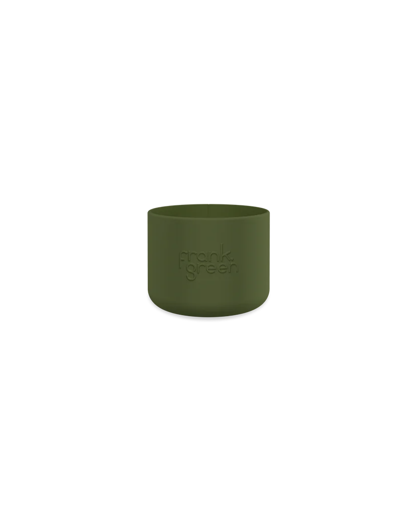 Against a black backdrop, the Bottle Bumper Guard Small Khaki by FRANK GREEN elegantly embraces a Ceramic Reusable Bottle with an embossed brand name.