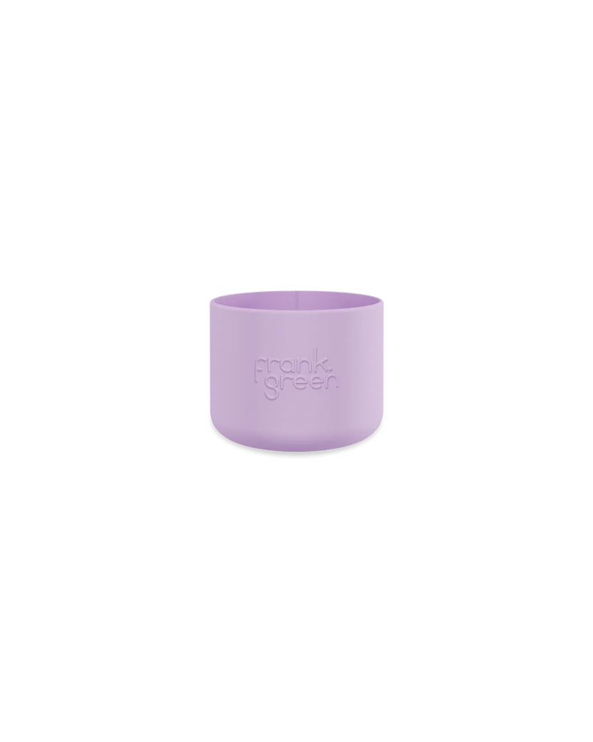 The Bottle Bumper Guard Small Lilac Haze by FRANK GREEN is a lavender cylindrical sleeve designed for Ceramic Reusable Bottles. Set on a black background, it showcases its pastel hue and elegant sustainability.