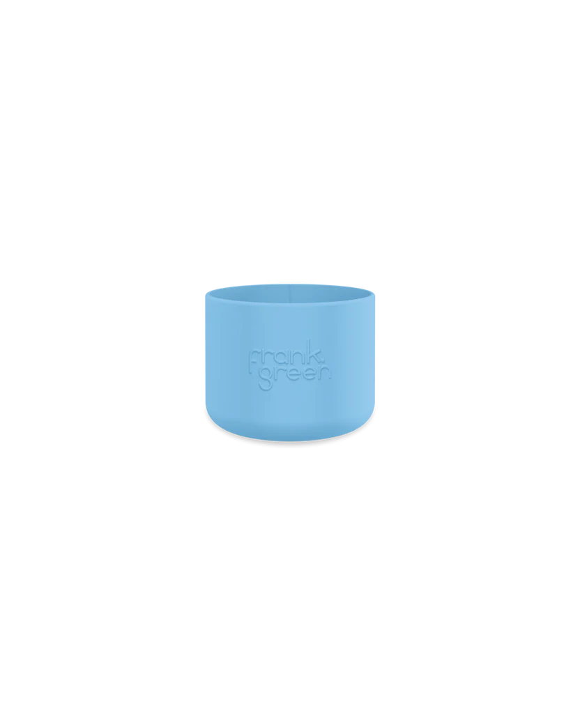 The Bottle Bumper Guard Small Sky Blue by FRANK GREEN, designed for the Ceramic Reusable Bottle, features the embossed "frank green" text. It is beautifully showcased against a sleek black background.