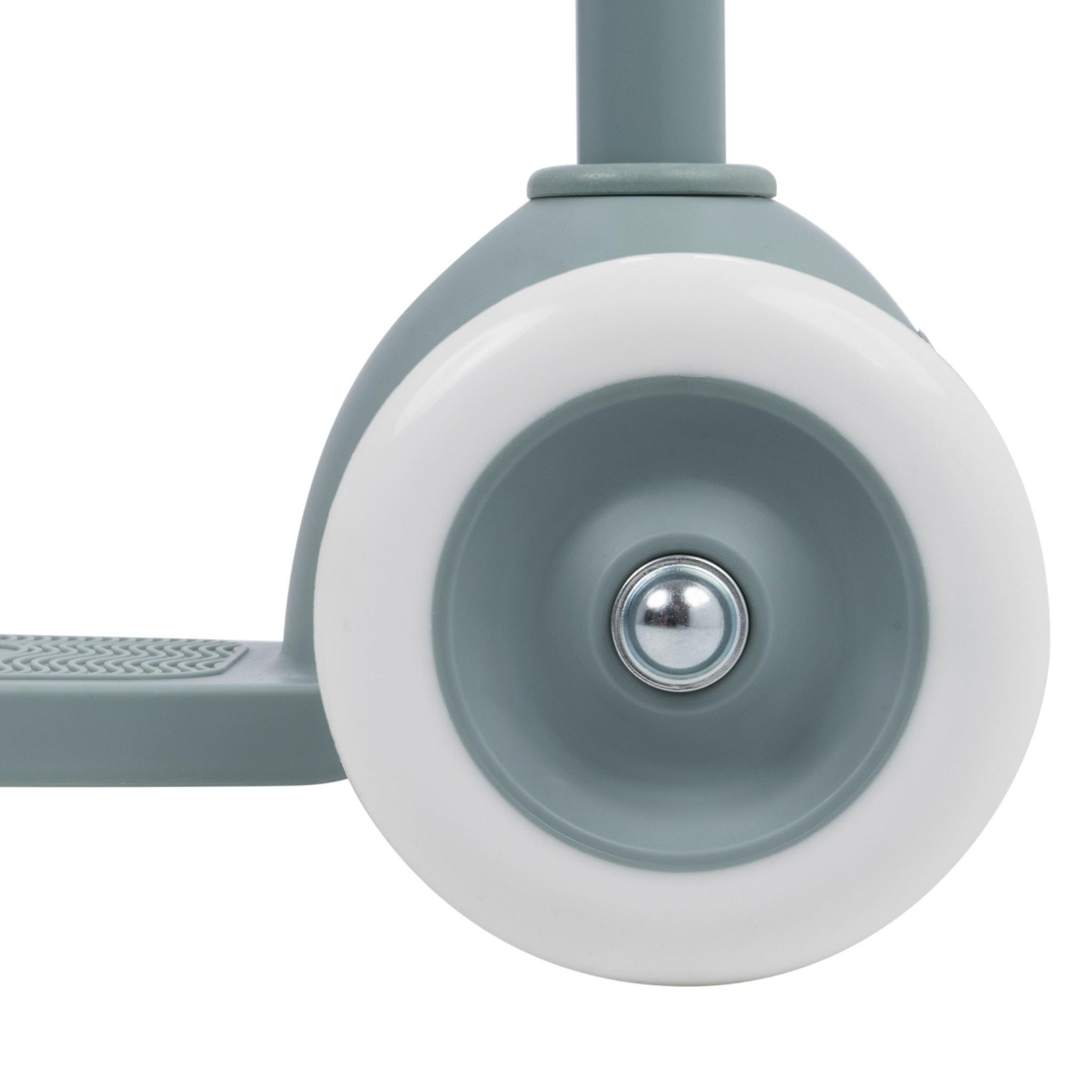 Close-up of a Banwood Eco Scooter Teal wheel by BANWOOD, showcasing a light gray tire and white rim, attached to a gray metal frame made from recycled plastic. The textured footplate is partially visible on the left.
