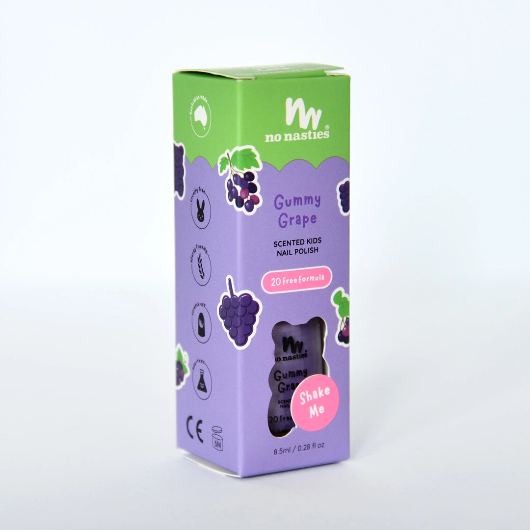 A purple and green box of NO NASTIES Scented Scratch Off Kids Nail Polish in Gummy Grape/Purple, 8.5ml, features grape images and promotes its 20-free, vegan, cruelty-free, non-toxic formula.