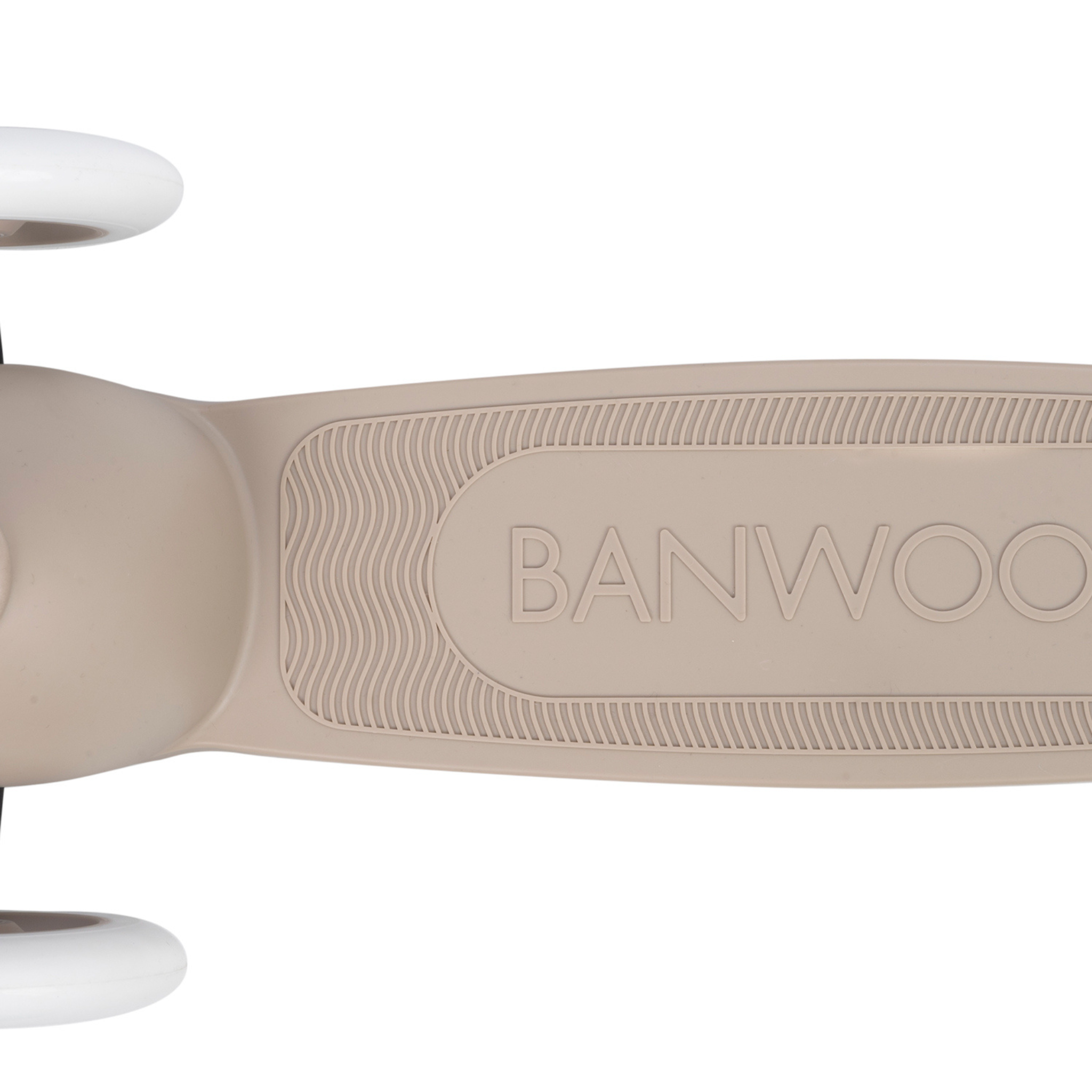 A close-up of the Banwood Eco Scooter Sand deck, crafted from post-consumer recycled plastic with "BANWOOD" imprinted, shows a textured non-slip surface. The partially visible white wheels feature an Easy Ride Steering System for smooth navigation.