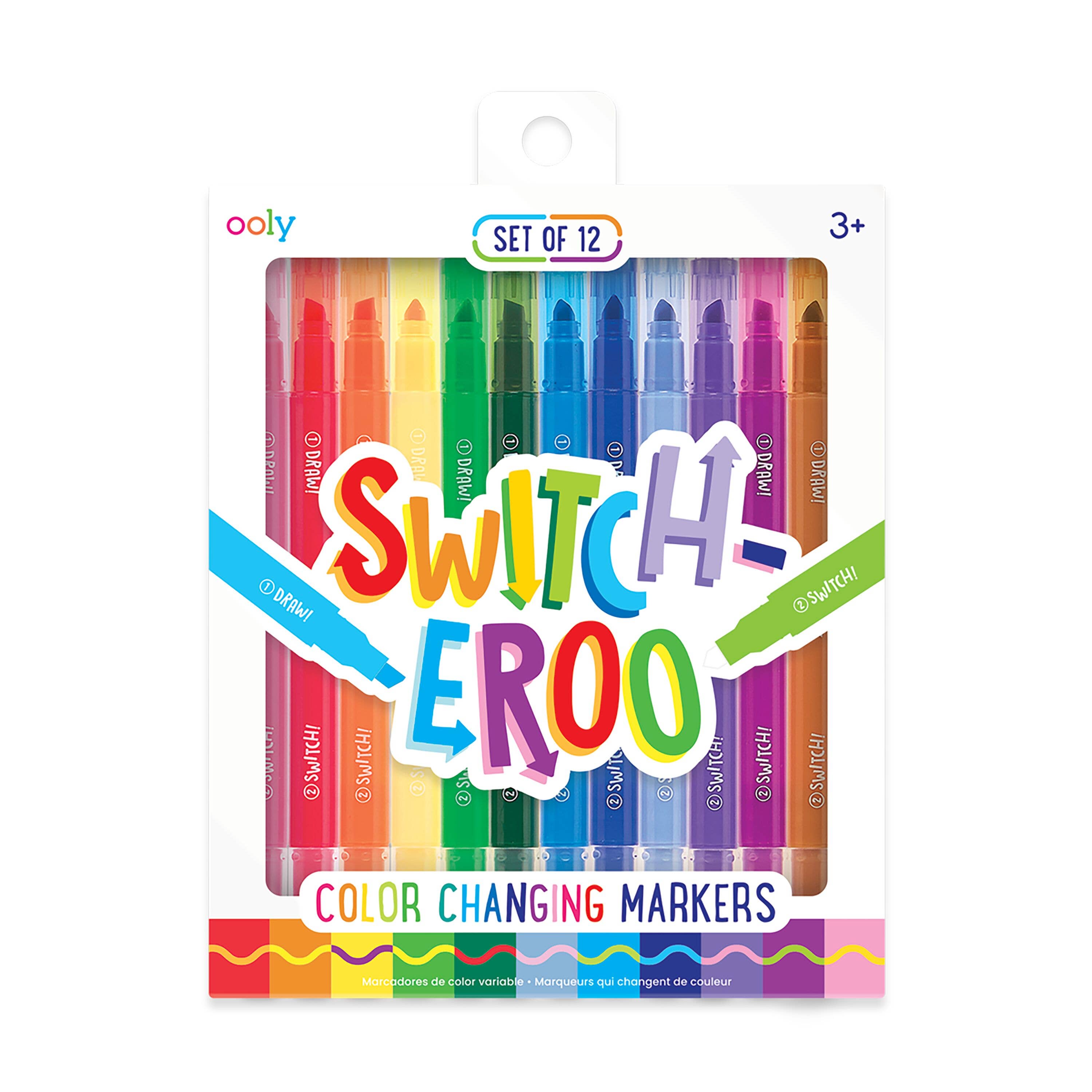 A set of 12 vibrant Switch-eroo! Color-Changing Markers 2.0 in a white package features "SWITCHEROO" vividly. Suitable for ages 3+, it proudly displays the OOLY brand on the top left—ideal for creative minds!.