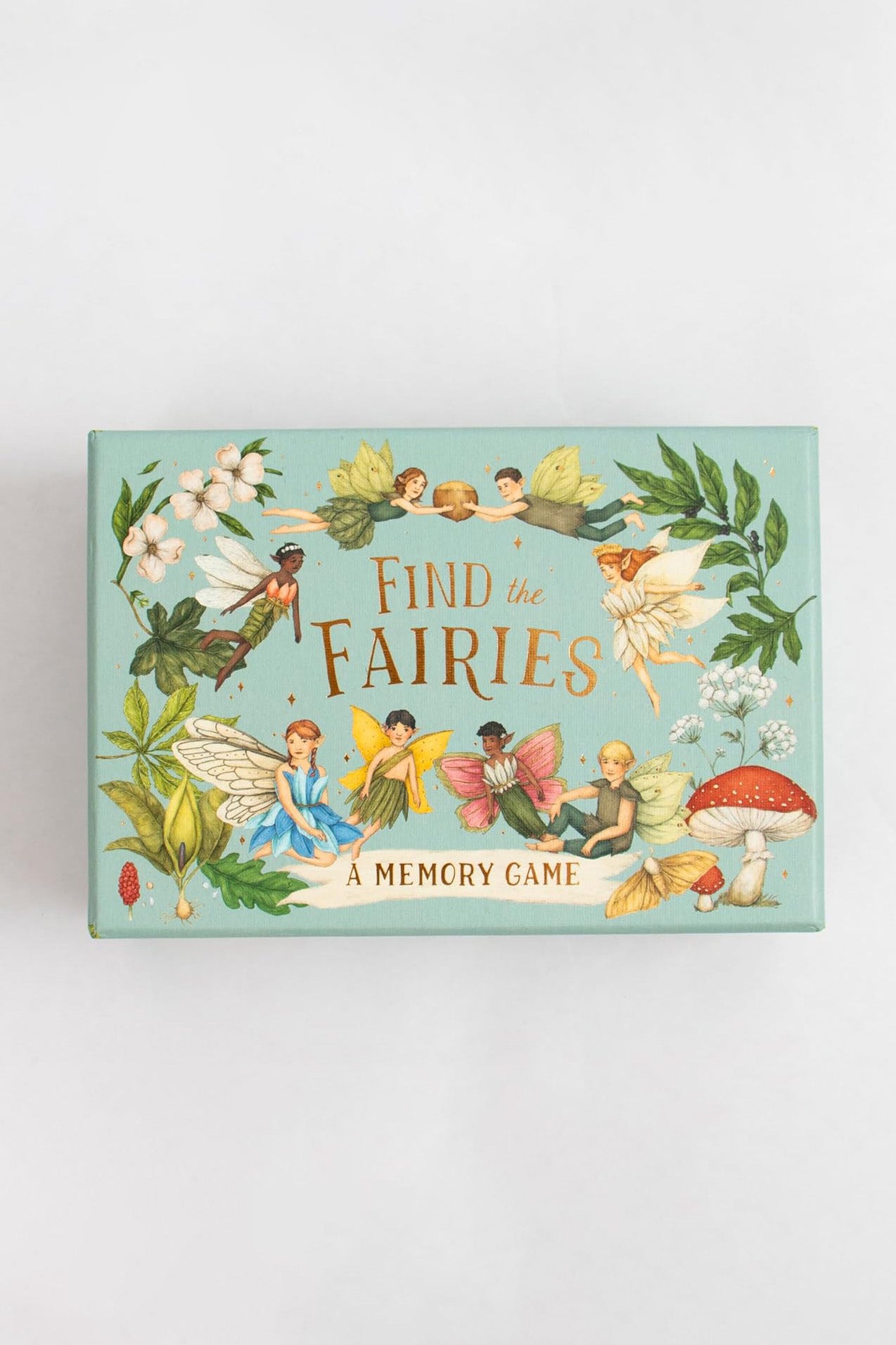 BAY KIDS’ Find the Fairies: A Memory Game comes in a pastel box with fairies, leaves, flowers, and mushrooms on a light blue-green background. Includes an illustrated booklet for gameplay guidance.