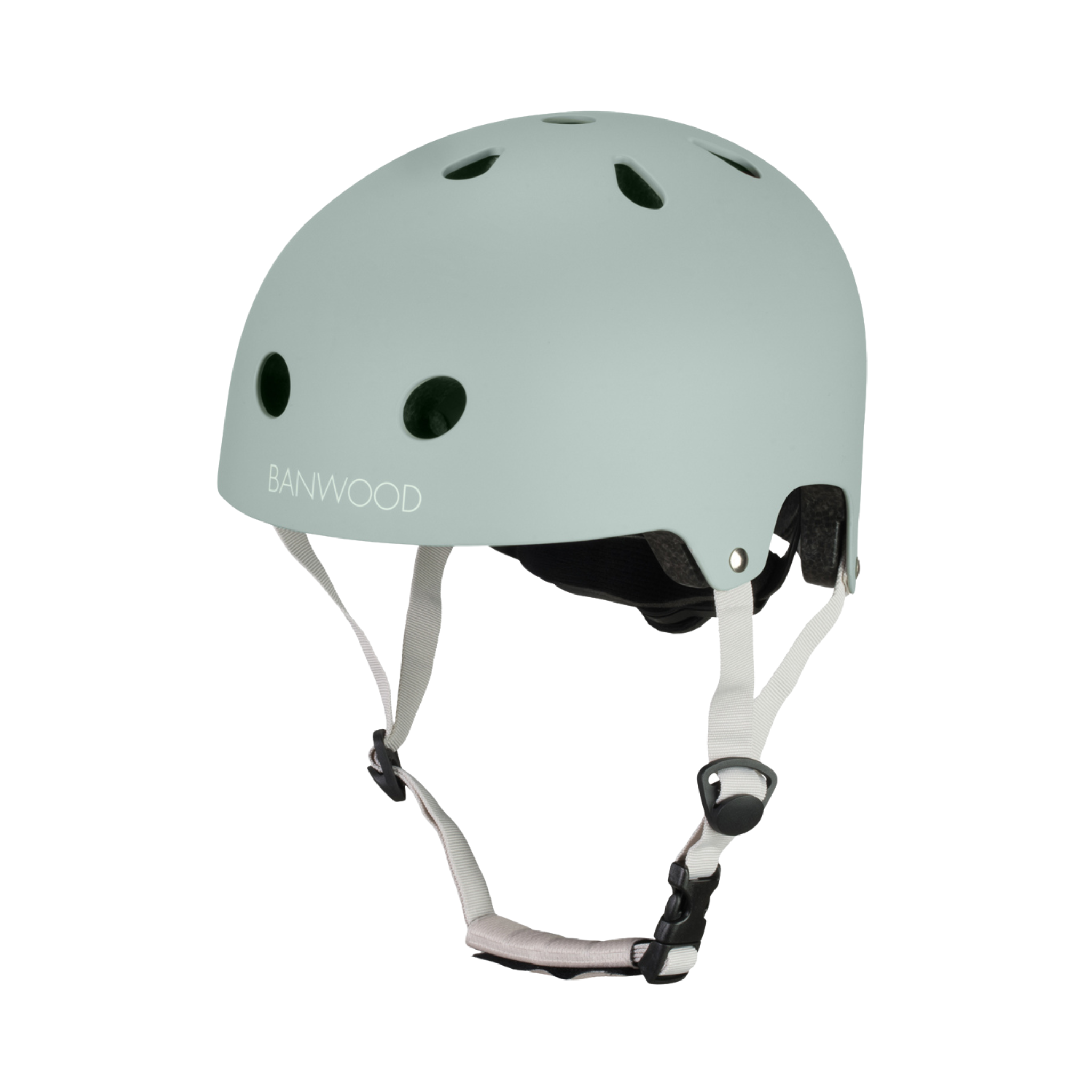 The Banwood - Eco Helmet Clay is a light green helmet made from eco-friendly recycled ABS. It features ventilation holes, adjustable white straps with a black buckle, and a dial-fit adjustment for comfort. The brand "BANWOOD" is displayed on the side.