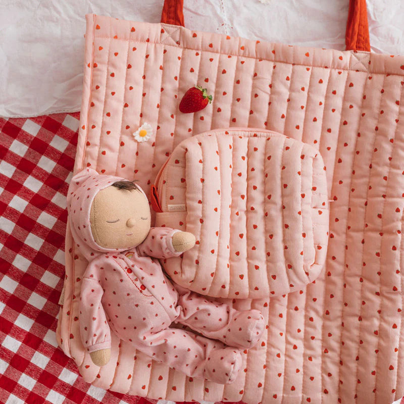 The OLLI ELLA - Quilted Toiletries Bag Strawberry is a cozy, quilted cotton pouch adorned with a playful strawberry print—perfect for storing toiletries, essentials, or small treasures on the go.