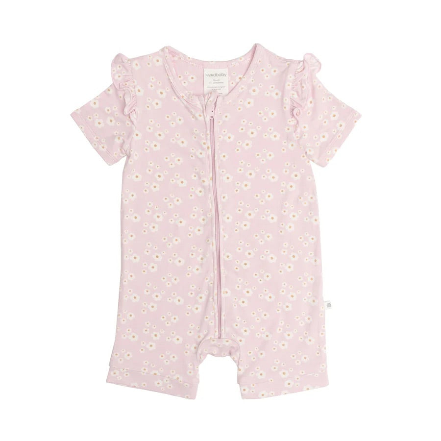 The Day or Night Short Sleeve Frill Onesie in Orchid Bloom by KYND BABY is a light pink baby romper featuring ruffled shoulders and white daisy patterns, crafted from soft viscose fabric gentle on newborn skin with a convenient front zipper closure.