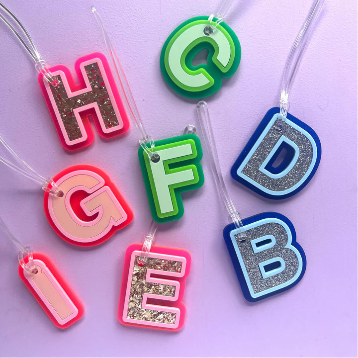 Luxe letter bag tags in green blue, pink and glitter.