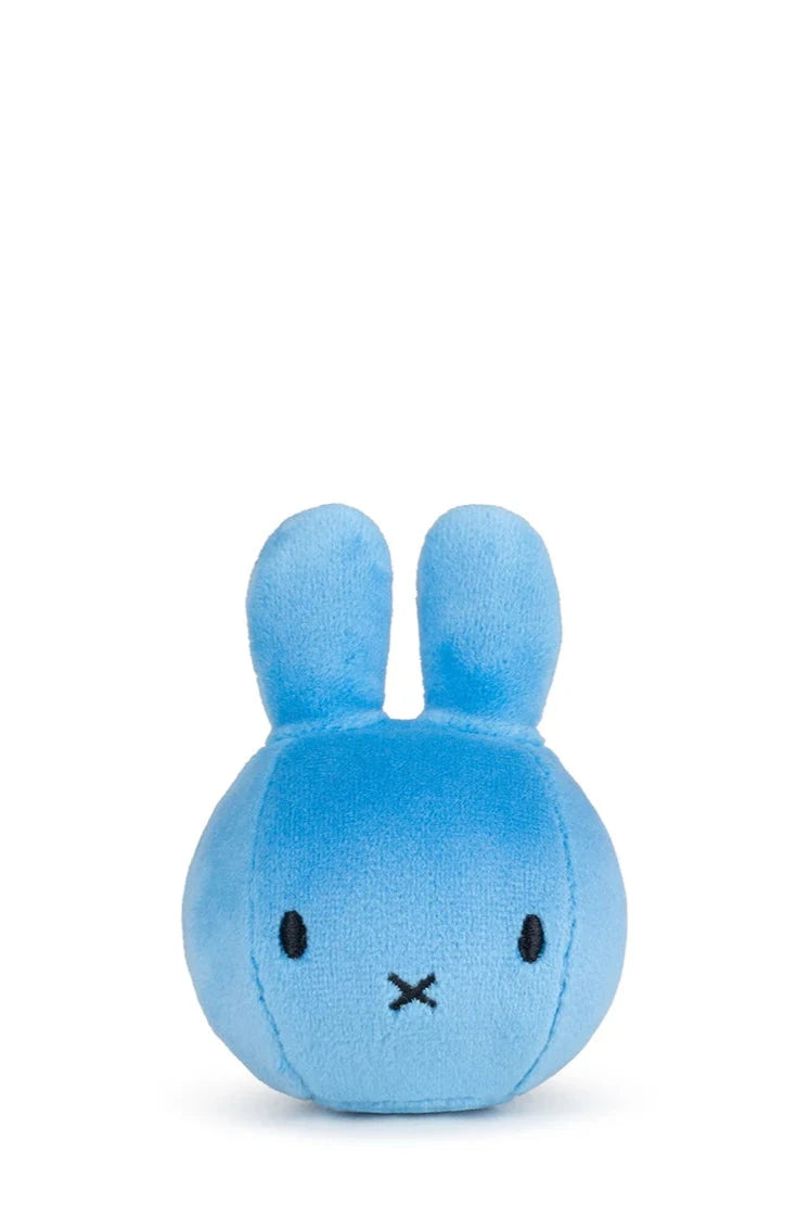 The Bon Ton Toys - Miffy Squish Ball Blue by BON TON TOYS X MIFFY is a small, round blue plush bunny with upright ears, black stitched eyes, and an “X” mouth, designed for stress relief and shown against a plain white background.