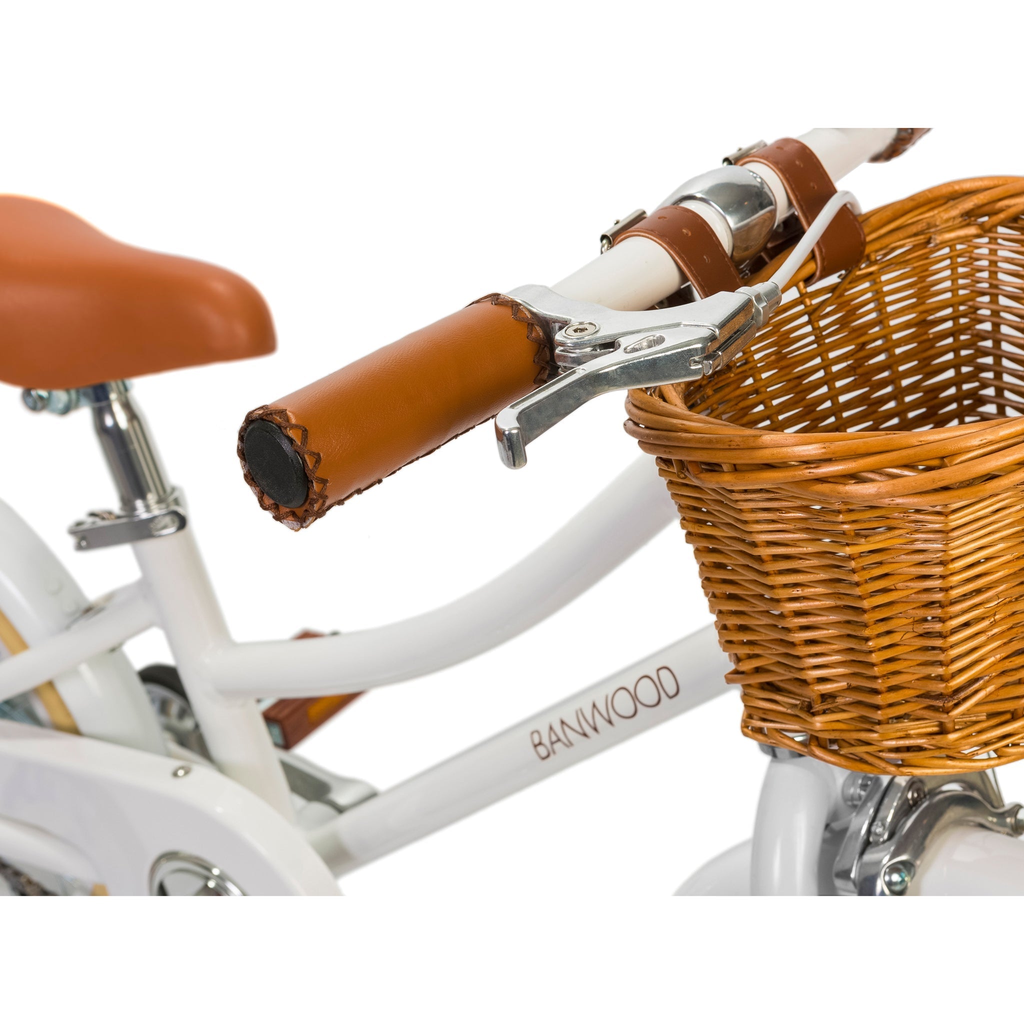 Check out the Banwood - Classic Bicycle White, featuring a Scandinavian design with a white frame and brown wicker basket. It exudes vintage charm with its brown leather-like grips and saddle, prominently displaying "BANWOOD" on the frame.