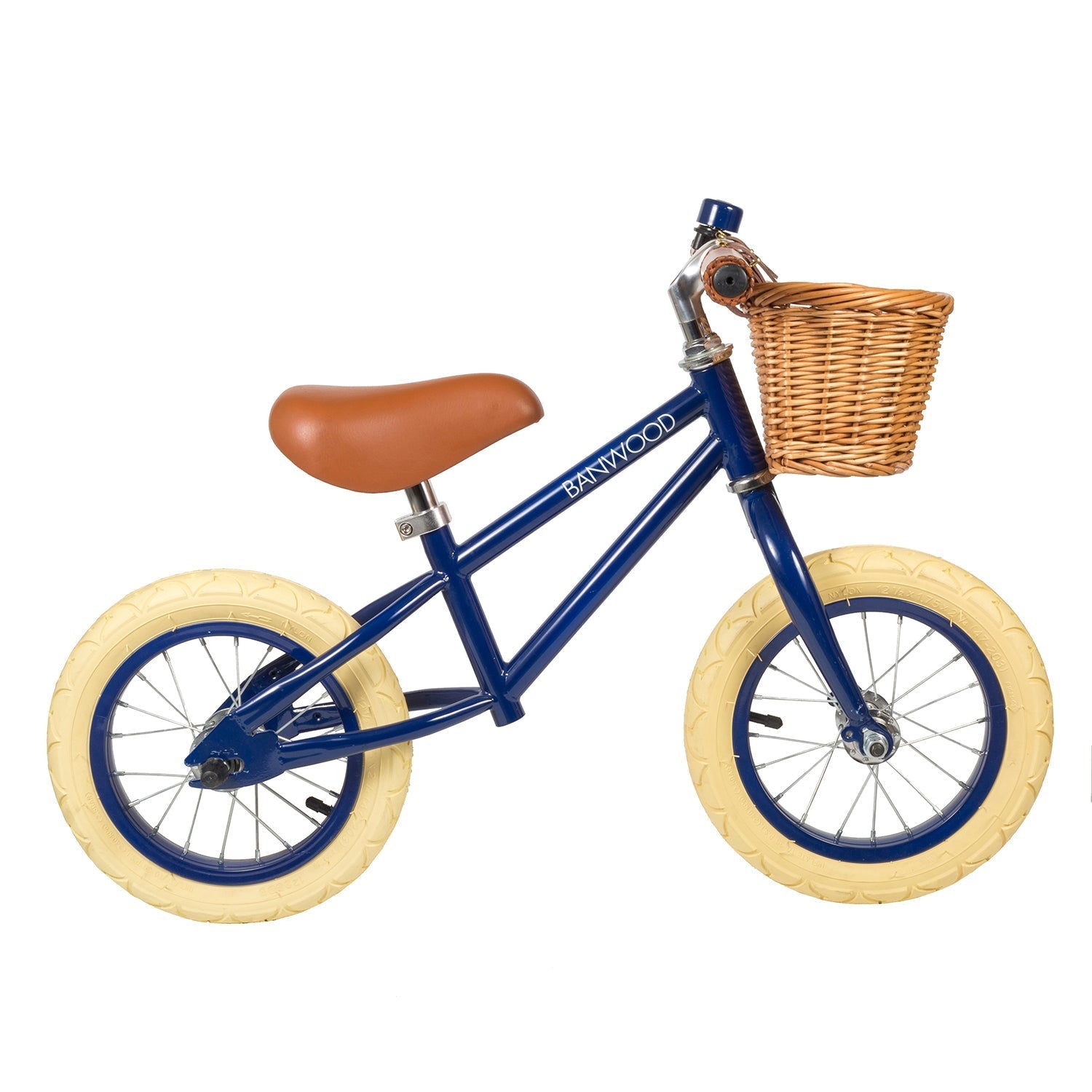 The "Balance Bike Vintage - Navy Blue" by BANWOOD is a children's balance bike with a vintage style, featuring a child-friendly frame and cream tires. It includes a brown seat and a wicker basket on the handlebars, with "BANWOOD" displayed on the frame.