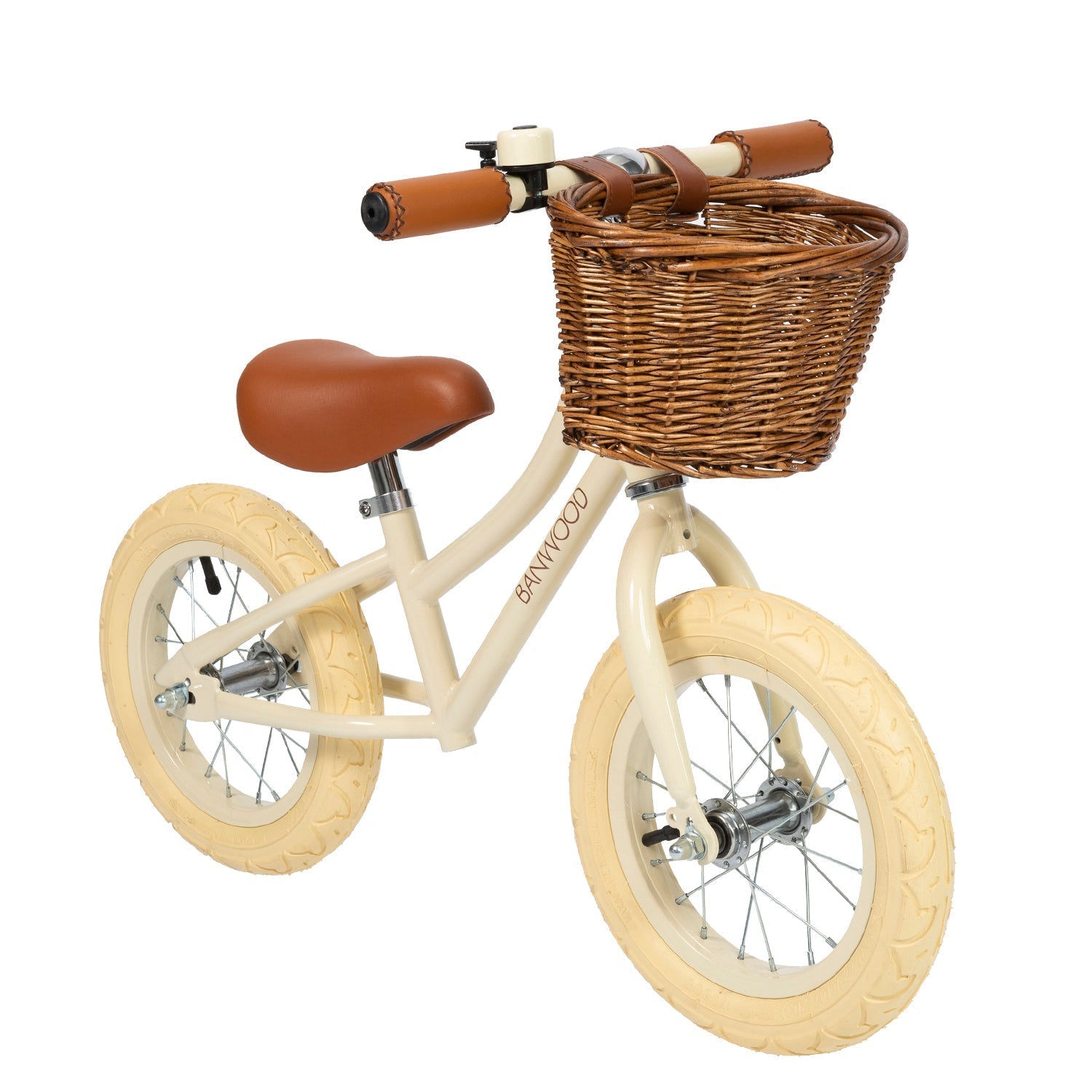 The Banwood Vintage Balance Bike Cream by BANWOOD features a cream-colored child-friendly frame with vegan leather brown seat and handlebars, a charming wicker basket on the front, wide beige tires, and a simple design.