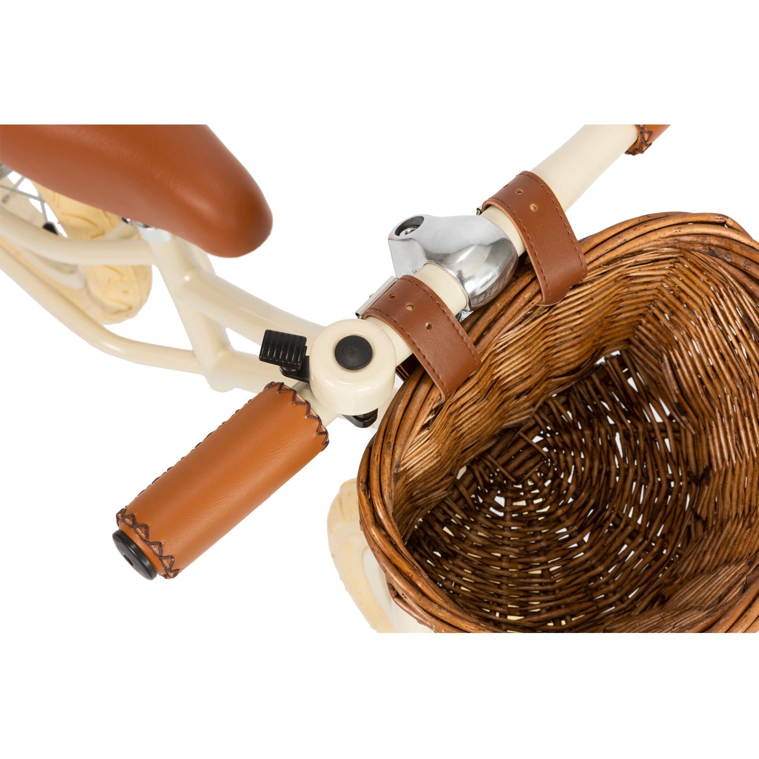Featuring a close-up of Banwood's Vintage Balance Bike, the image showcases a tan vegan leather handlebar grip, brown wicker basket, and cream frame. The bike is complete with a tan saddle emphasizing its elegant design by BANWOOD.
