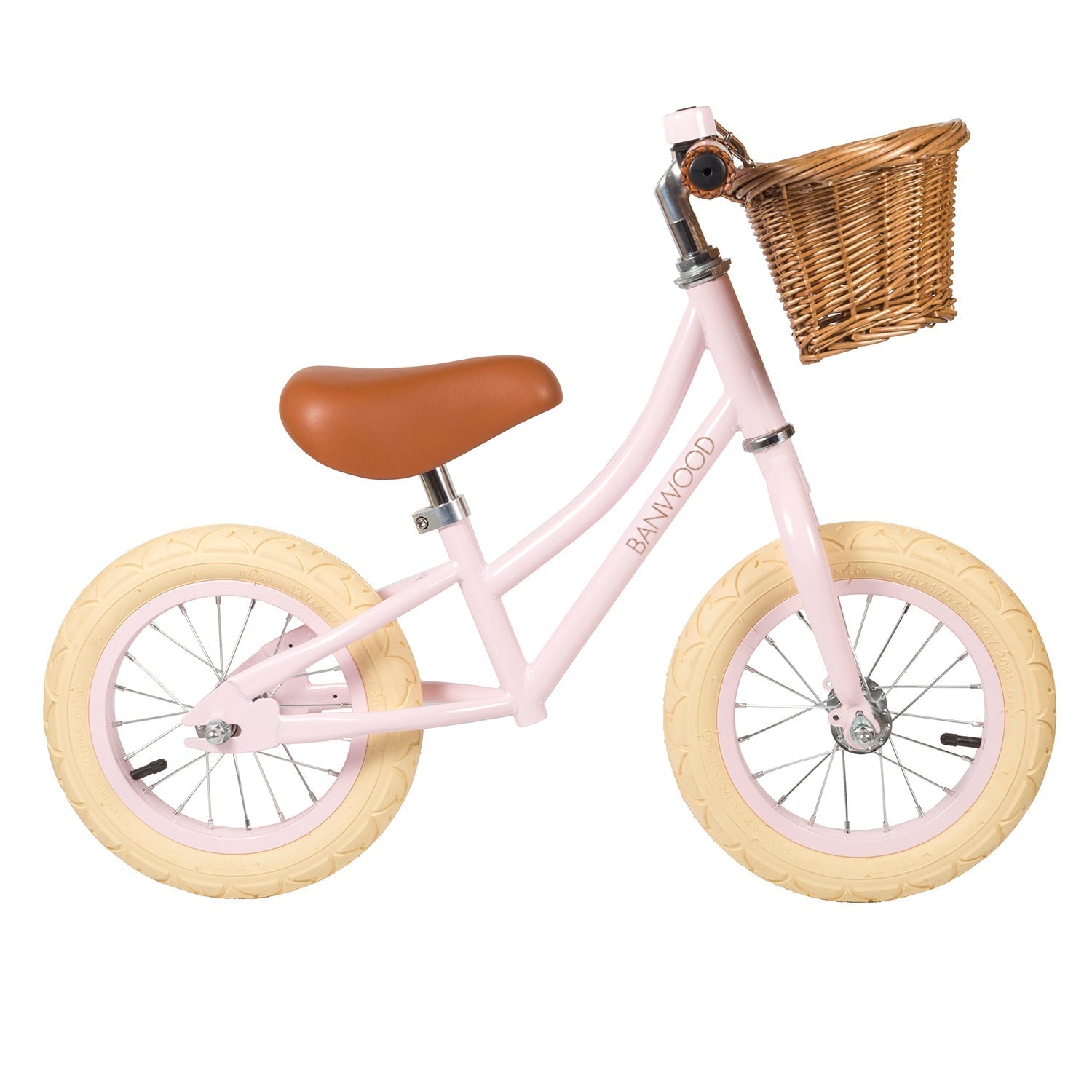 The Banwood - Vintage Balance Bike Pink features a vintage style with cream wheels, a brown vegan leather seat, and a charming wicker basket in front. The brand name "BANWOOD" is elegantly displayed on the frame.