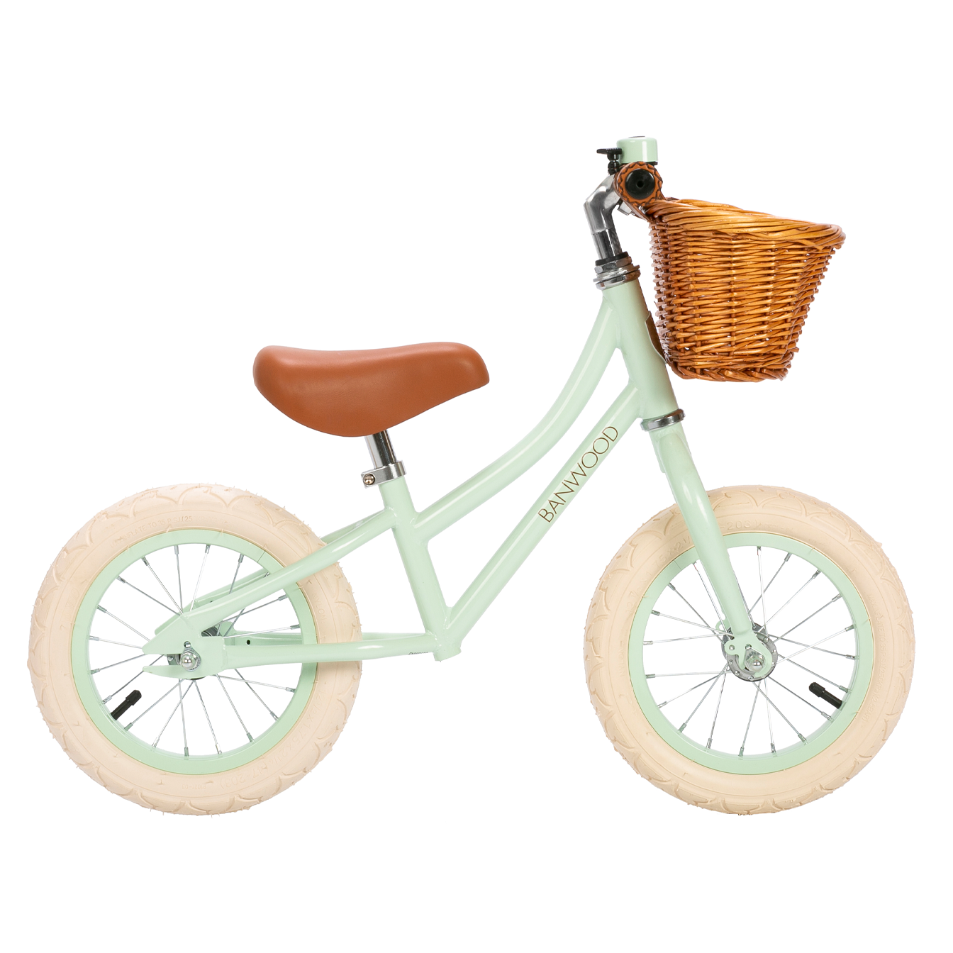The Banwood - Vintage Balance Bike Pale Mint is styled with a child-friendly mint green frame featuring cream tires, a brown leather saddle, and a charming wicker basket on the handlebars. The word "BANWOOD" is elegantly displayed on the frame.