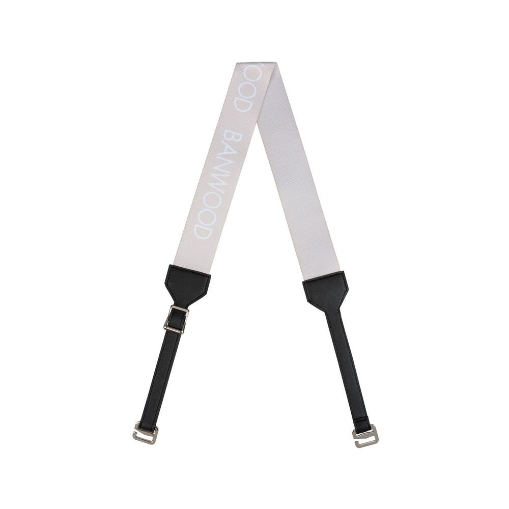 A cream-colored BANWOOD Carry Strap with "BANWOOD" in light gray capital letters. Ideal for balance bikes or scooters, it includes black adjustable ends and silver clasps for easy attachment to bags or cases.