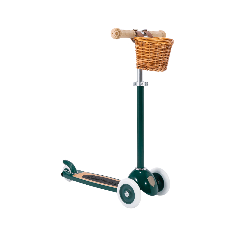 The Banwood - Scooter Green by BANWOOD features a sleek design with three white wheels, tan handles, and a green frame. It includes a wicker basket for vintage charm and Easy Ride Steering for smooth navigation.
