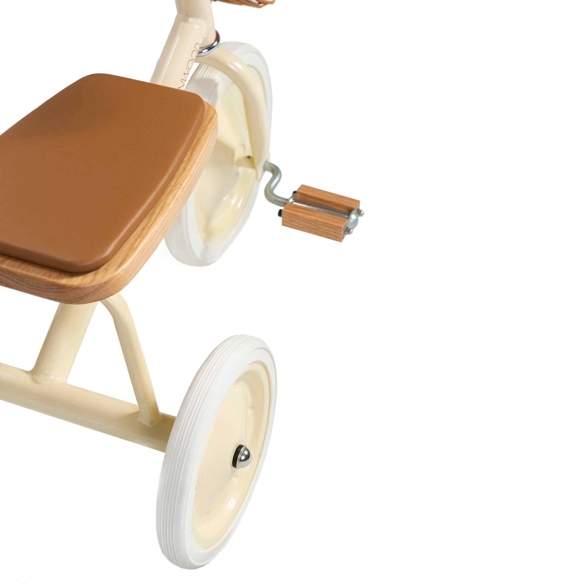 The image shows a close-up of the BANWOOD Trike Cream, featuring a beige frame with a brown seat, wooden pedals, and white wheels. It includes a charming front wicker basket, captured on a white background displaying both the back and part of the front wheel.