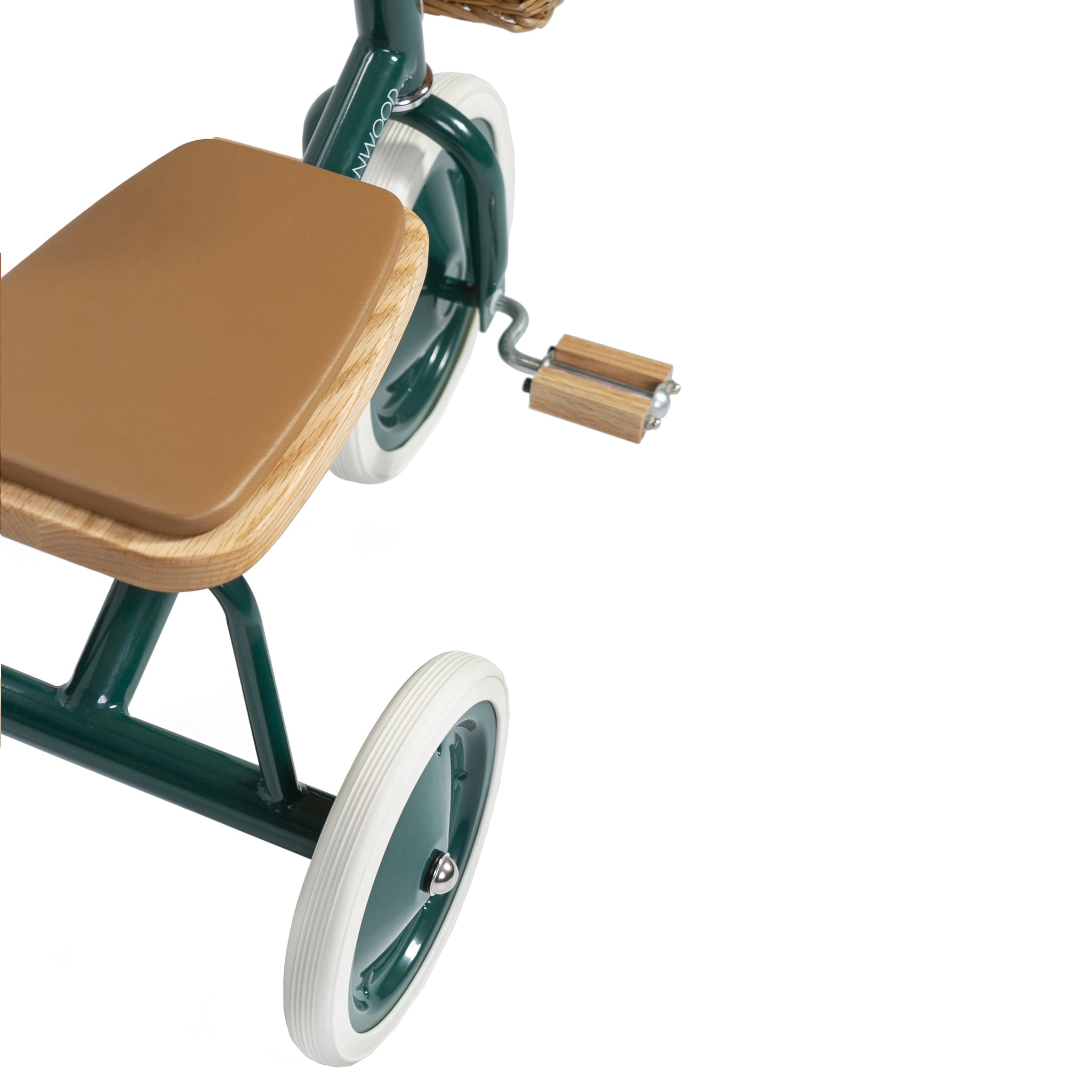 Close-up of Banwood - Trike Green by BANWOOD featuring a wooden seat and pedals, white tires, a green metal frame blending retro and modern designs, and a charming front wicker basket for added playfulness.