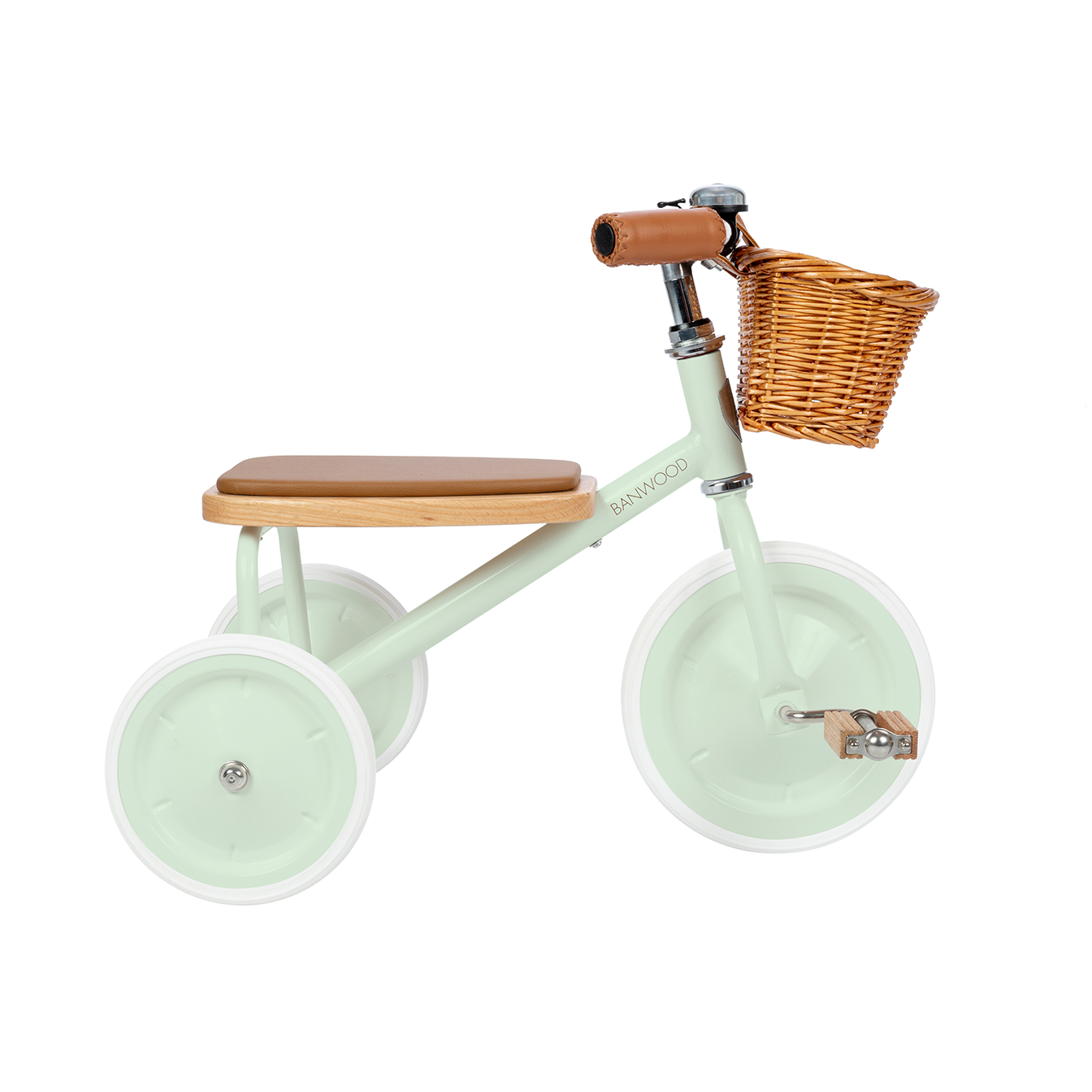 The Banwood Trike Pale Mint by BANWOOD is shown in pastel green, featuring a wooden seat, brown leather handles, white wheels, and a small wicker basket at the front. The design is minimalistic and vintage-inspired, making it a stylish choice for a kids' tricycle.