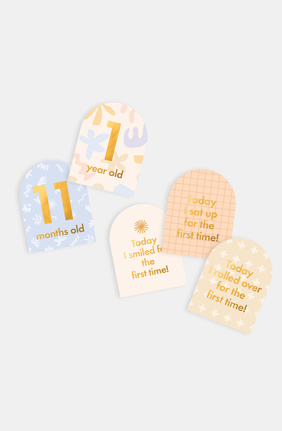 Capture special moments with FOX & FALLOW's Baby Milestone Cards Helios—five vibrant, rounded cards that celebrate “11 months old,” “1 year old,” and first milestones like smiling, sitting up, and rolling over.