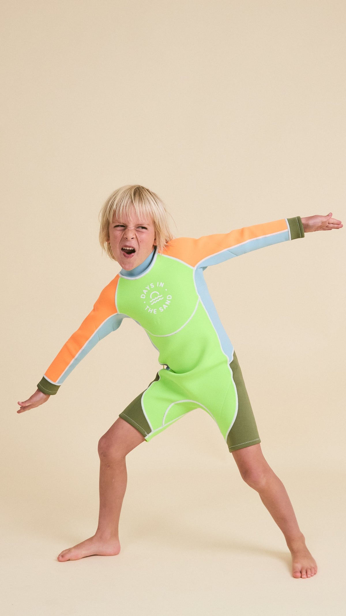 Child wearing Days in the Sand Wild Lime springsuit
