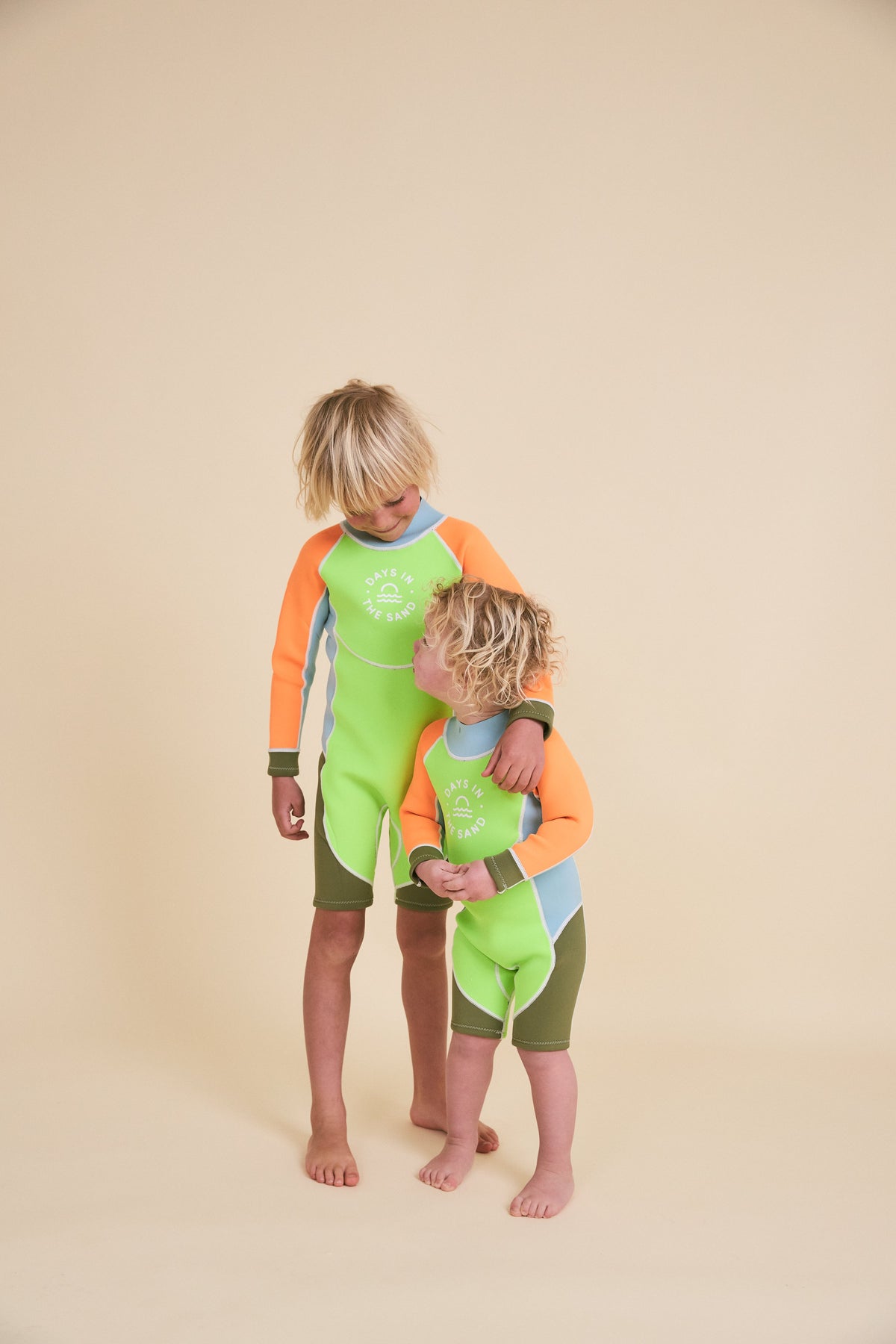 Child wearing Days in the Sand Wild Lime springsuit