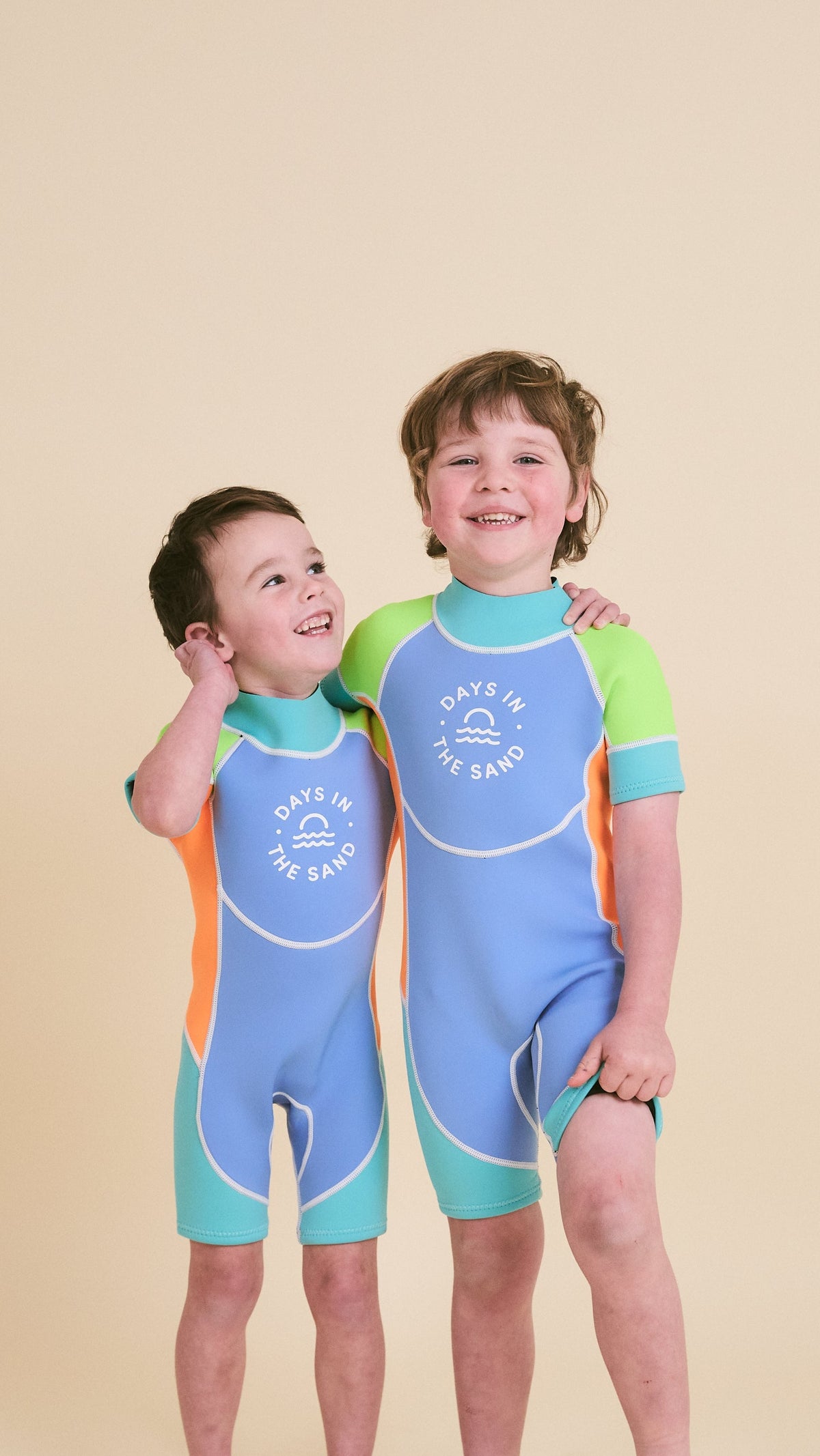 Child wearing Days in the Sand Green Pop springsuit