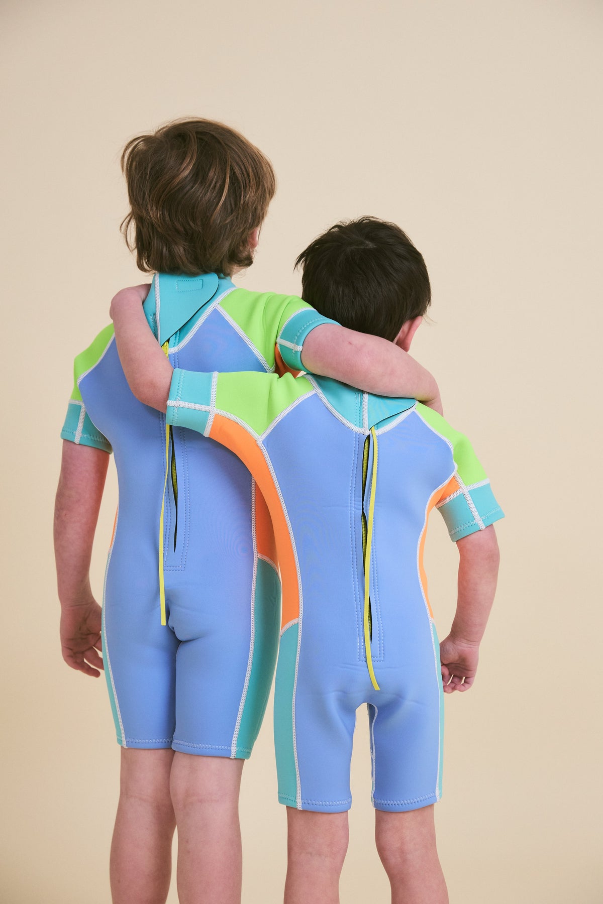 Child wearing Days in the Sand Green Pop springsuit