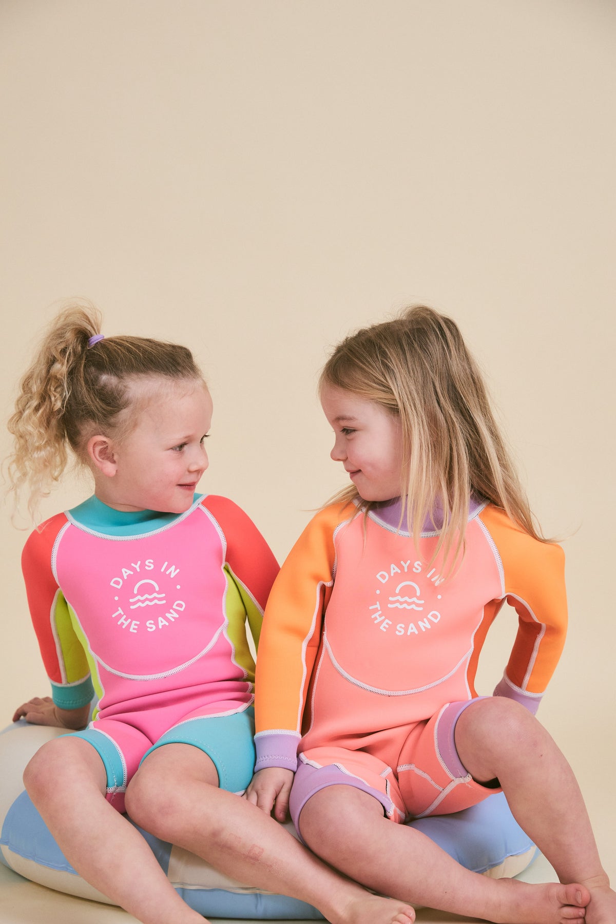 Child wearing Days in the Sand Bubblegum Breeze springsuit