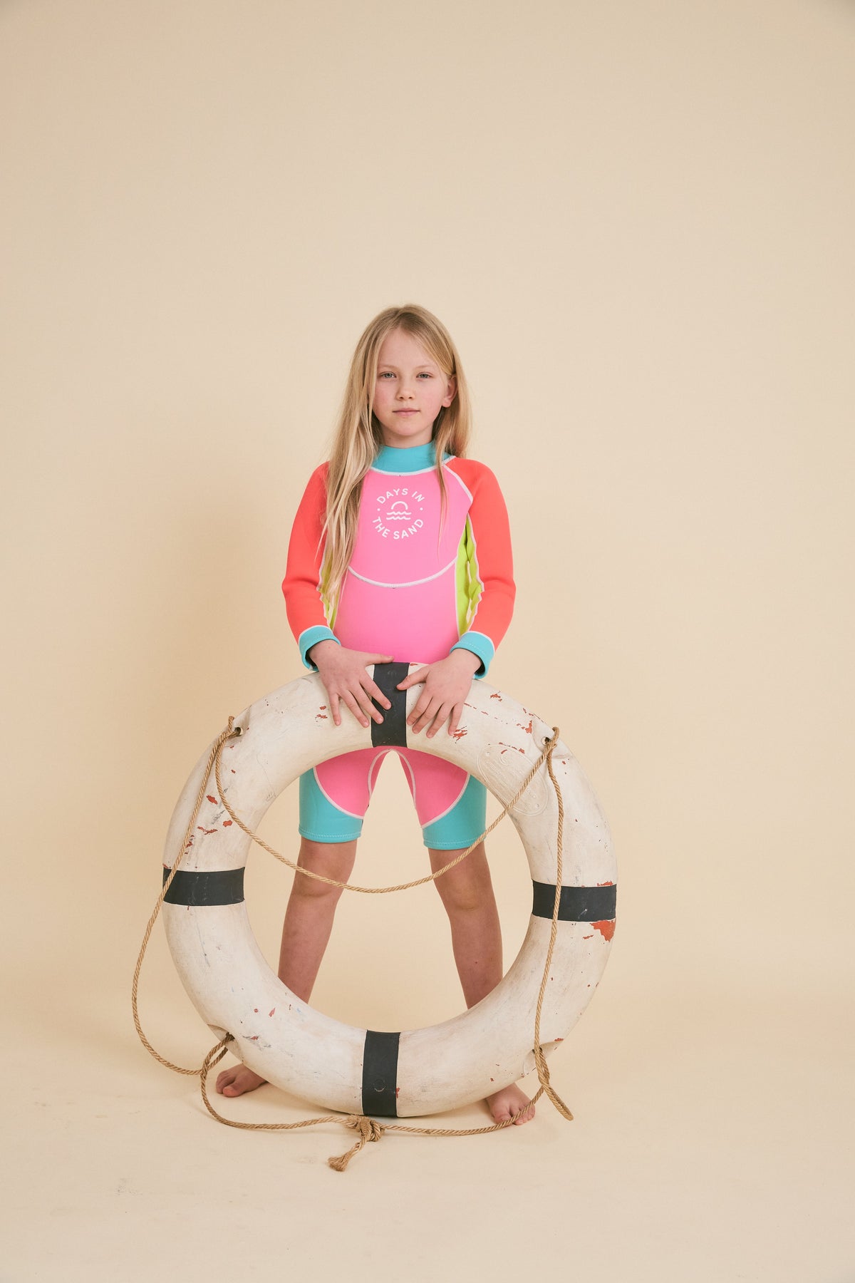 Child wearing Days in the Sand Bubblegum Breeze springsuit