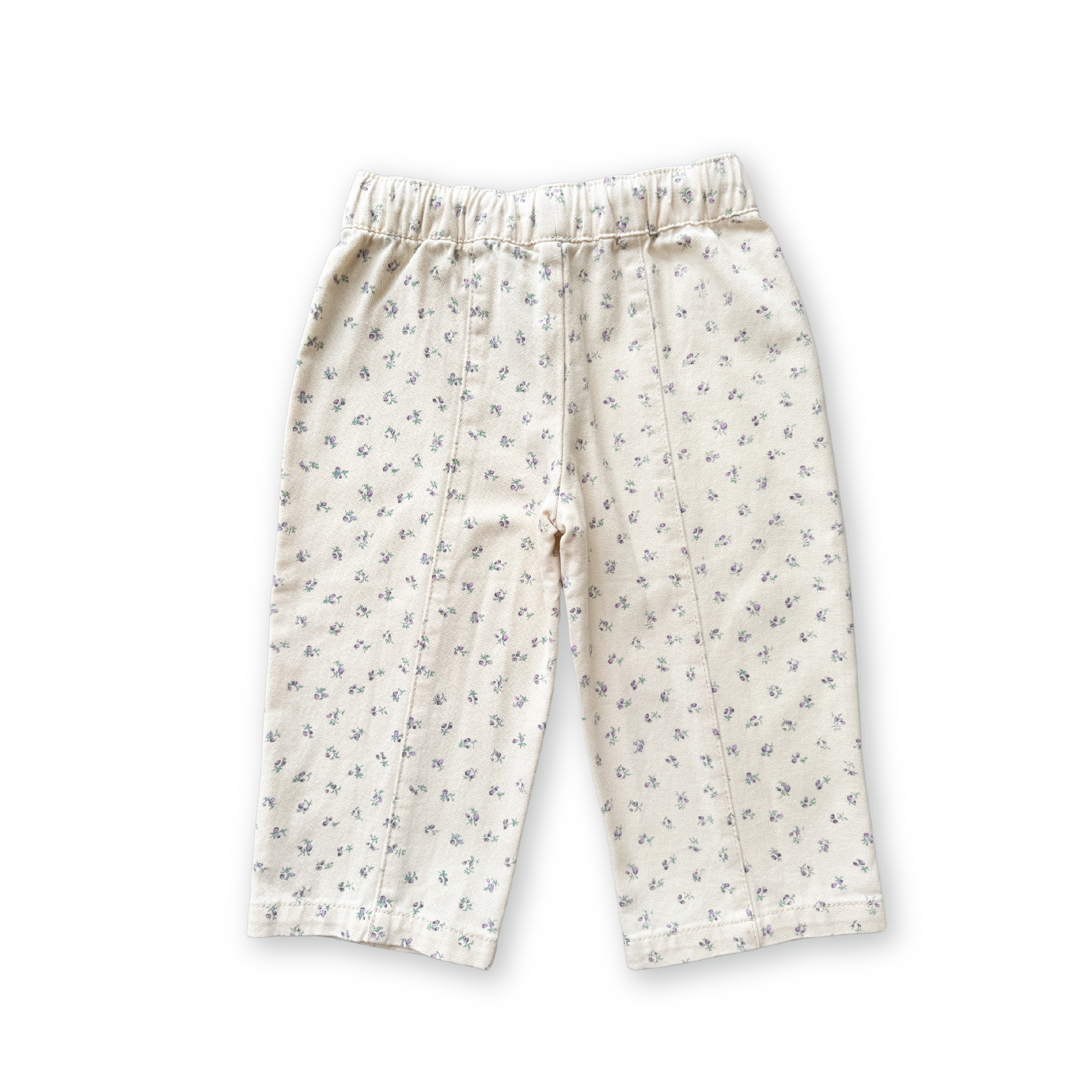 The GROWN Everyday Pants Garden are cream-colored toddler pants with a subtle floral print and a comfy cotton elastic waistband, shown on a white background with a black shadow outline.