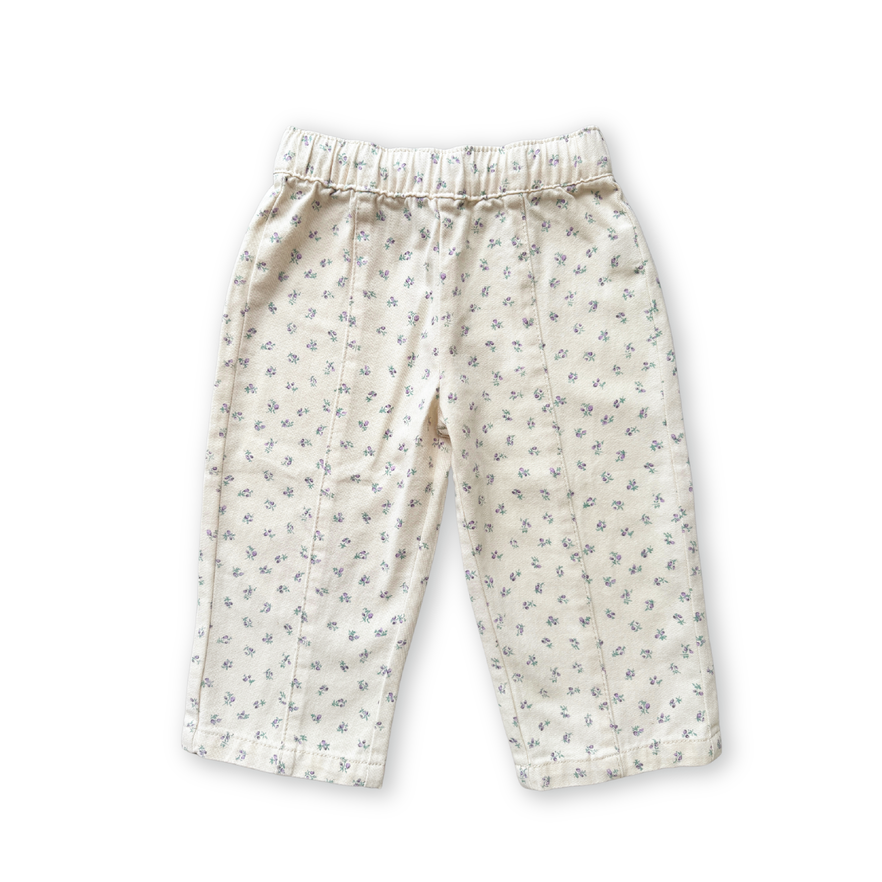 The GROWN Everyday Pants Garden are beige children’s relaxed fit pants featuring a subtle floral print, cotton elastic waistband, and straight legs, shown on a plain white background.