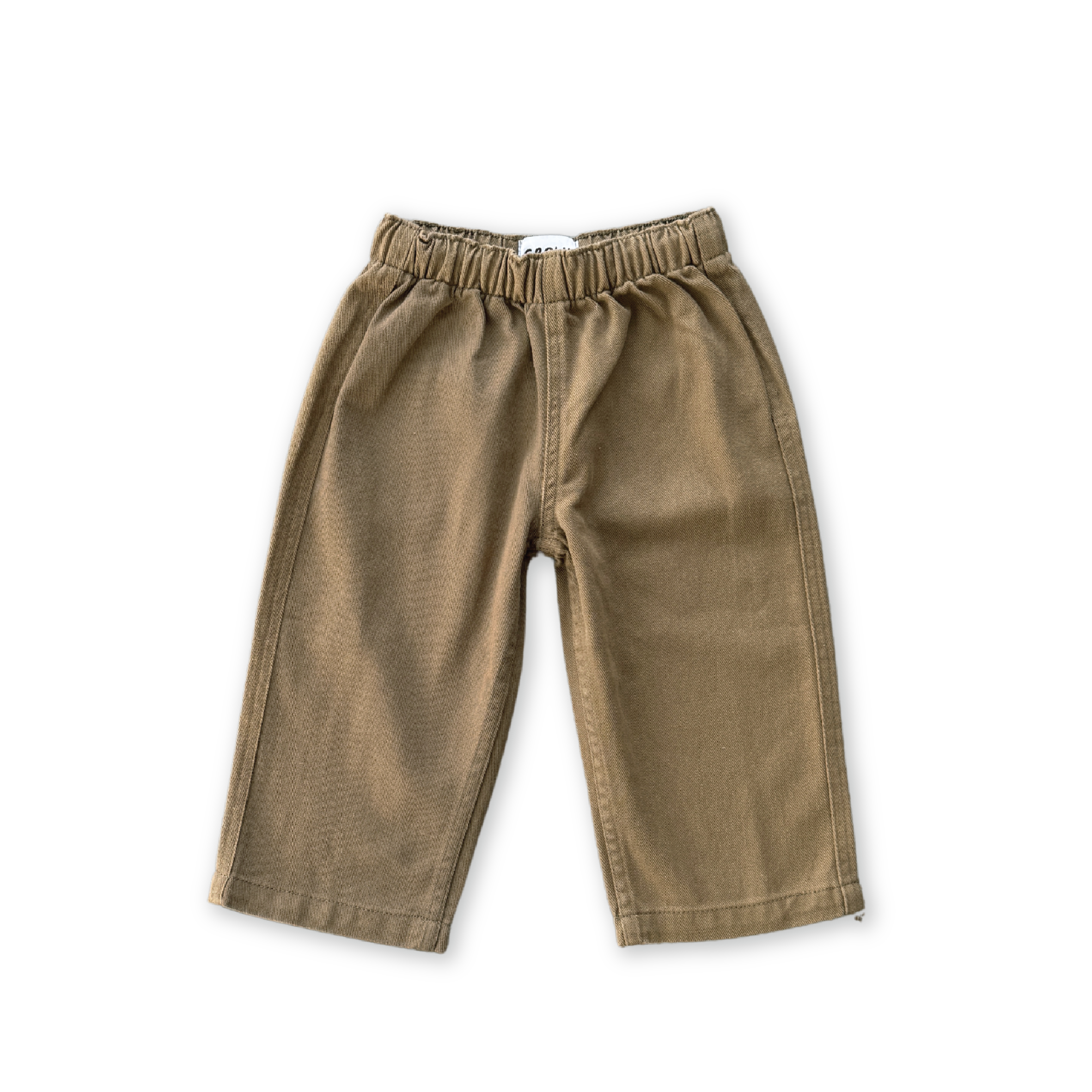 The GROWN Organic Everyday Denim Pant Coffee features a relaxed fit, straight legs, and an elastic waistband in soft organic cotton. Shown laid flat on a black background, this simple children's pant ensures comfort and style.