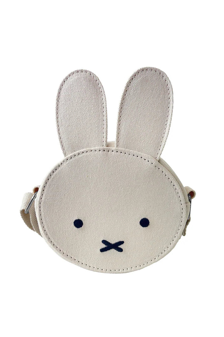 The ENGELITE Engelite - Miffy Canvas Ears Crossbody Bag Off White is a small kids shoulder bag shaped like Miffy's face, with long upright ears, black embroidered eyes, and an "X" mouth on the front.