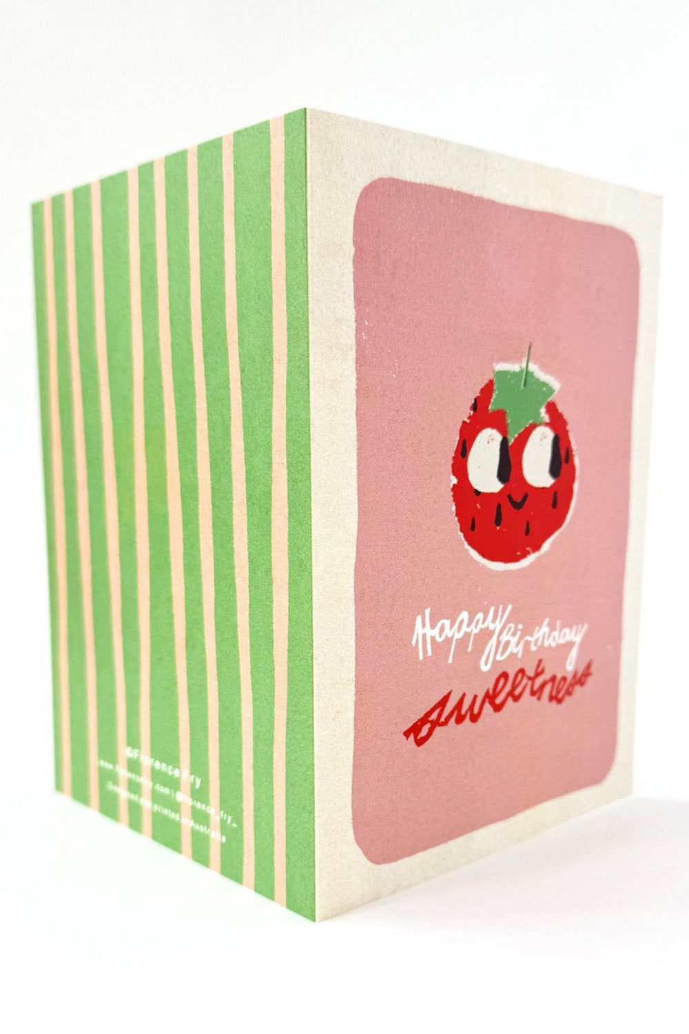 The FLORENCE FRY "Florence Fry - Birthday Greeting Card 'Happy Birthday Sweetness'" features green and beige stripes, a pink strawberry front with handwritten text, comes with a recycled kraft envelope, and is printed on FSC-approved paper.
