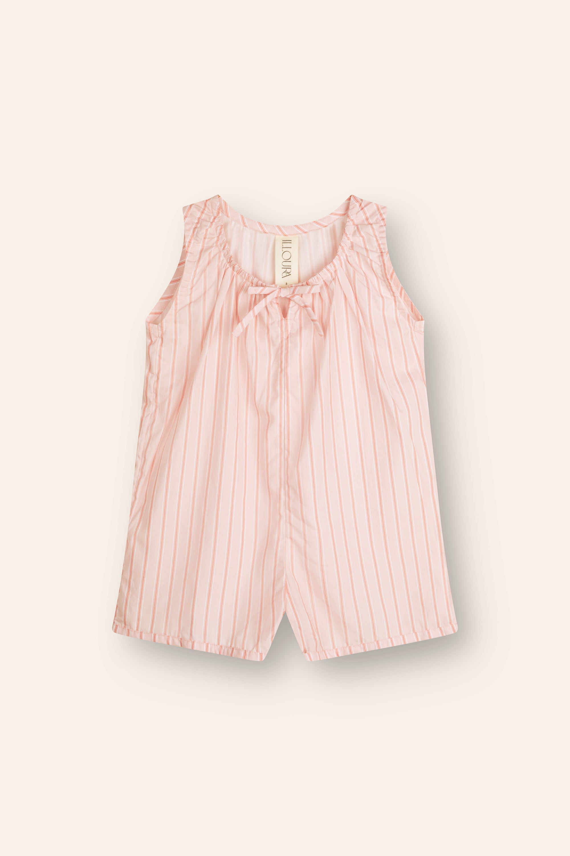 The Illoura the Label - Sadie Overalls Pink Stripe by ILLOURA THE LABEL is a sleeveless toddler romper in pink stripe cotton poplin with white vertical stripes and a small neckline bow, shown on a plain cream background.