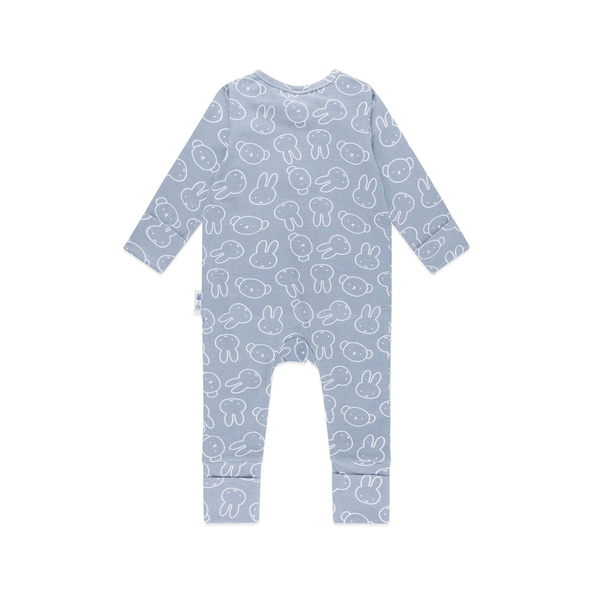 The KYND BABY Kynd Baby - Miffy Day Or Night Onesie Moody Blue is a long-sleeve blue organic cotton onesie with white bunny and face illustrations, shown flat with the back side facing up.