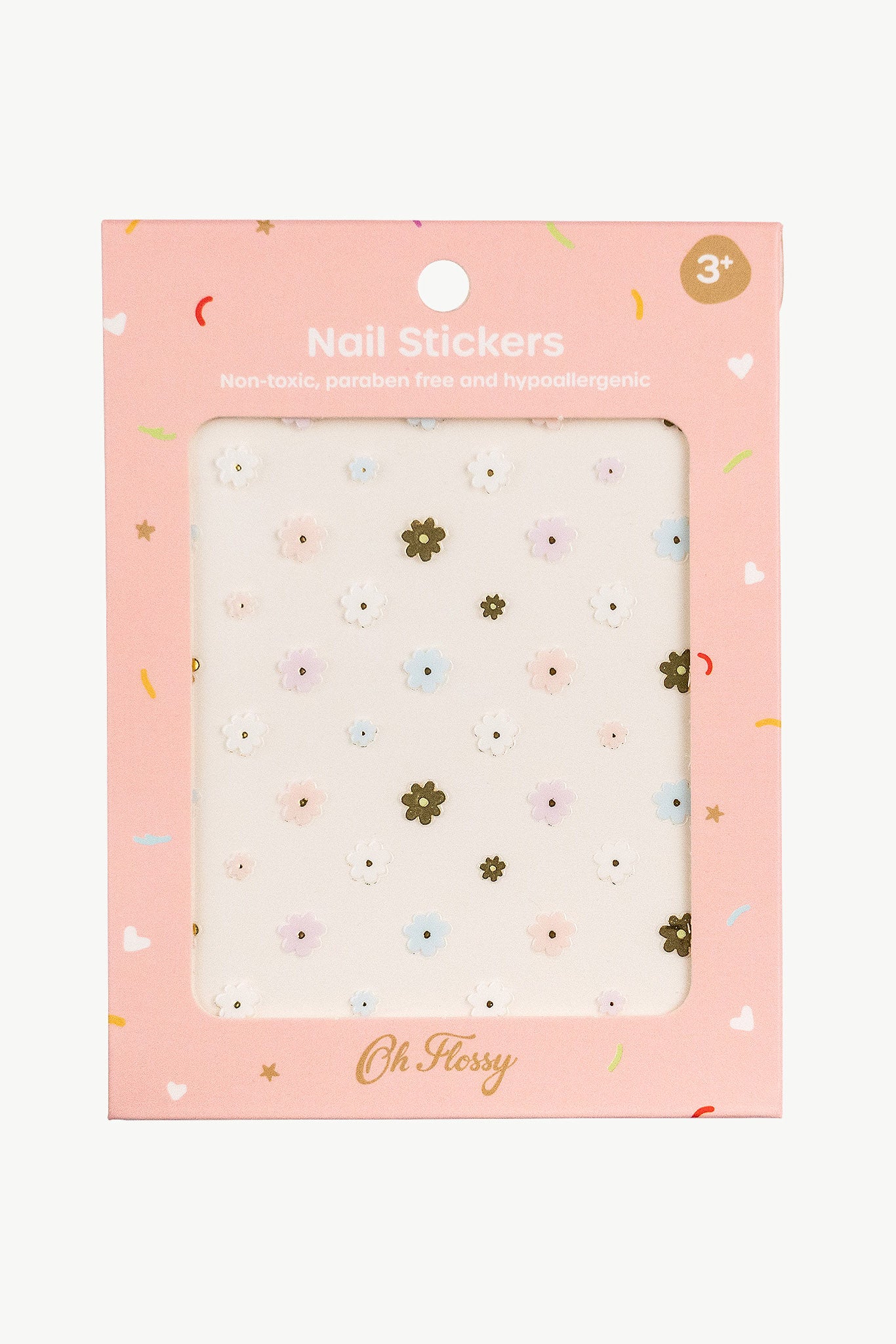 The pink Oh Flossy packaging for kids' nail stickers displays charming floral designs and reads "Nail Stickers," highlighting a non-toxic, paraben-free, hypoallergenic formula suitable for ages 3+. The OH FLOSSY brand is prominently featured at the bottom.