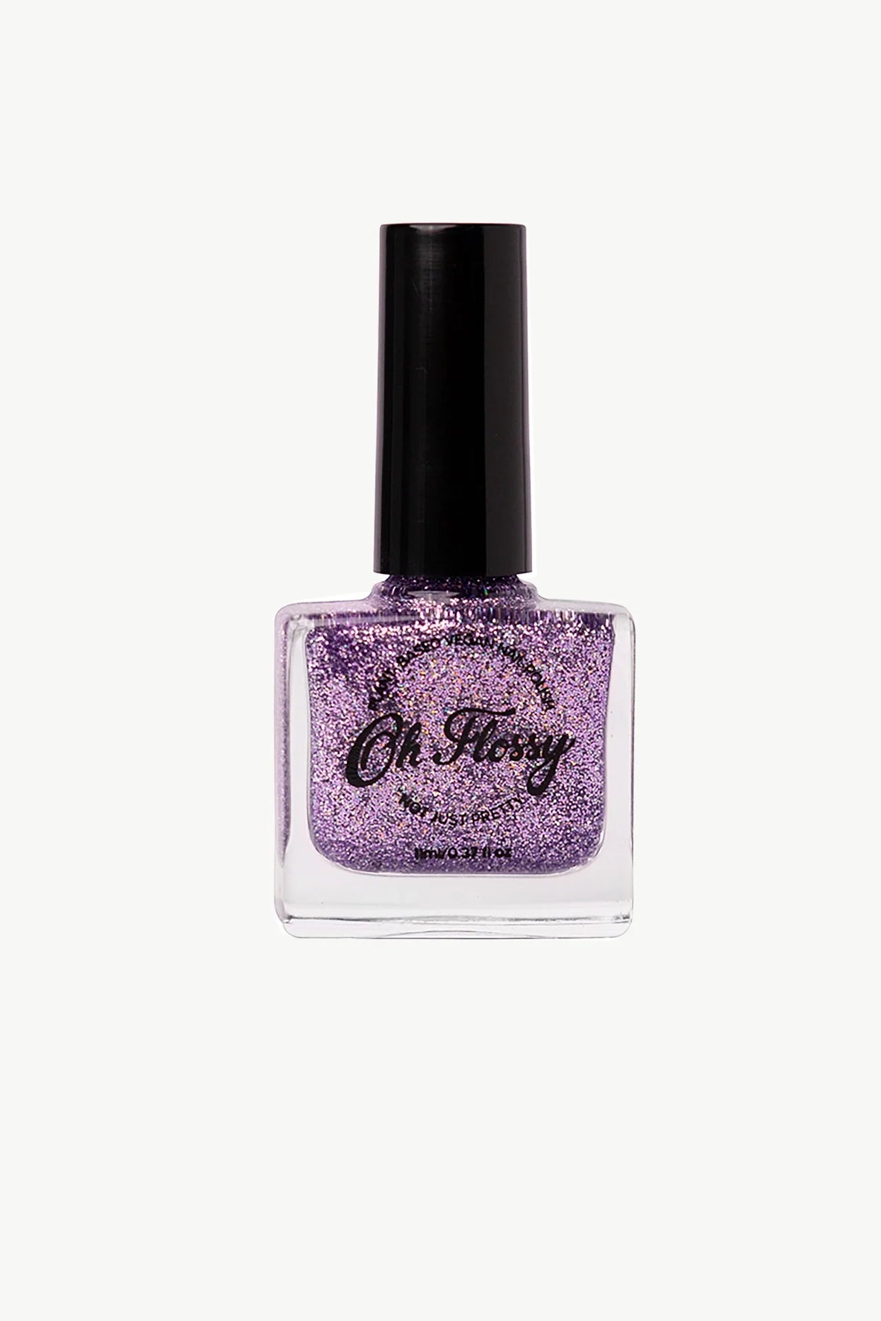 The Oh Flossy ~ Storytime Nail Polish Set, perfect for young fashionistas, features square bottles of purple glitter polish with sleek black caps. Enjoy its quick-dry formula and plant-based ingredients for sparkling nails in no time.