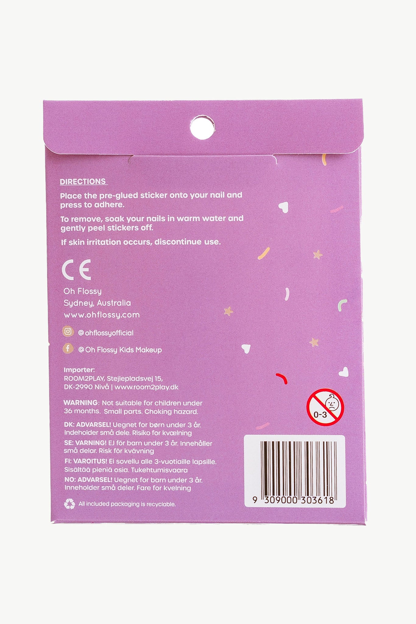Back view of the Oh Flossy ~ Nail Stickers Magical Garden package in purple, showing directions and warnings in English. Features OH FLOSSY logo, barcode, social media handles, star and confetti graphics, plus an age 0-3 warning symbol with a crossed-out icon.