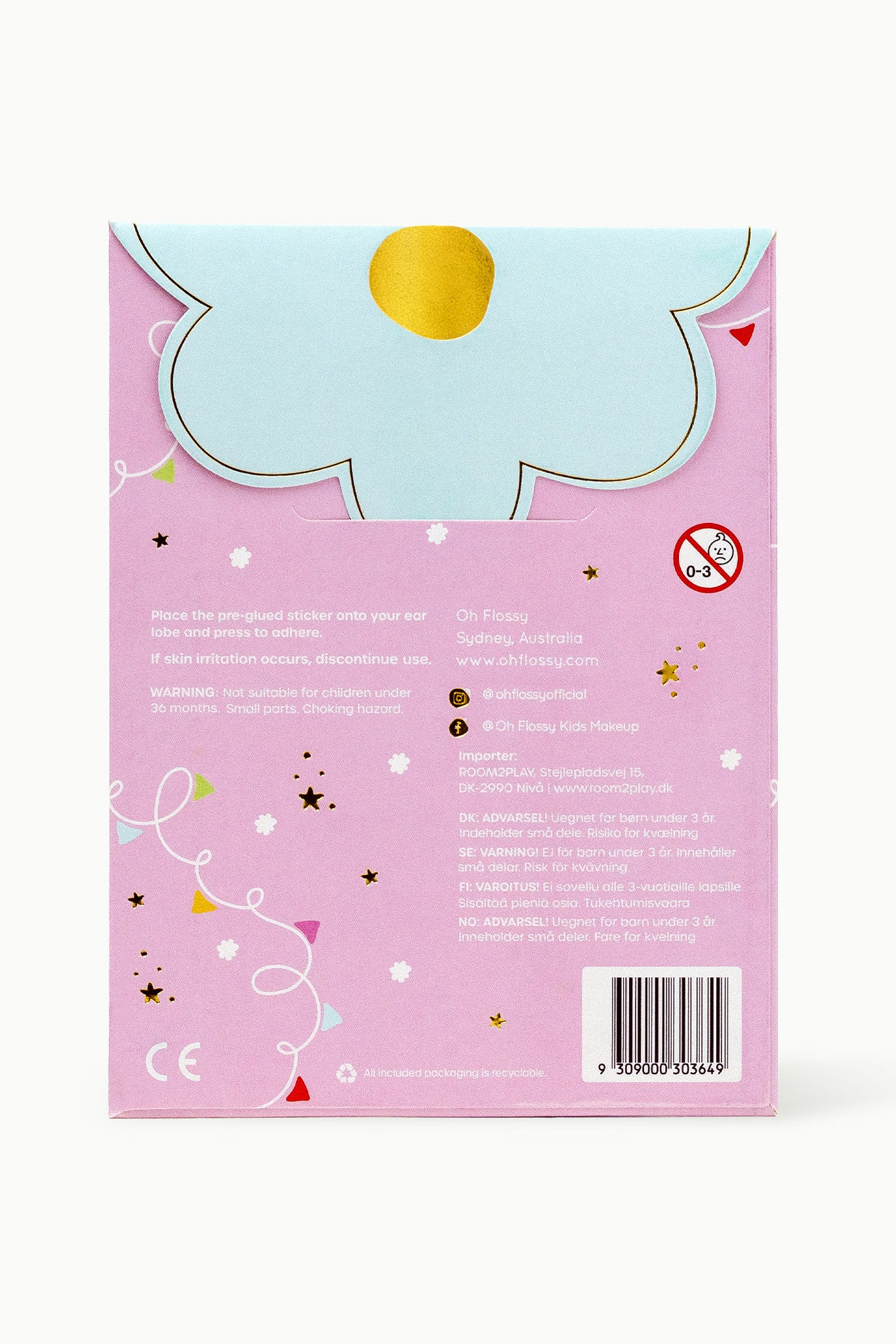 The Oh Flossy Kids Stick-On Earrings package features a pastel pink background with large light blue flower and yellow center, adorned with stars, swirls, and a no-children-under-3 icon. It's designed with non-toxic materials ensuring safe accessories for children.