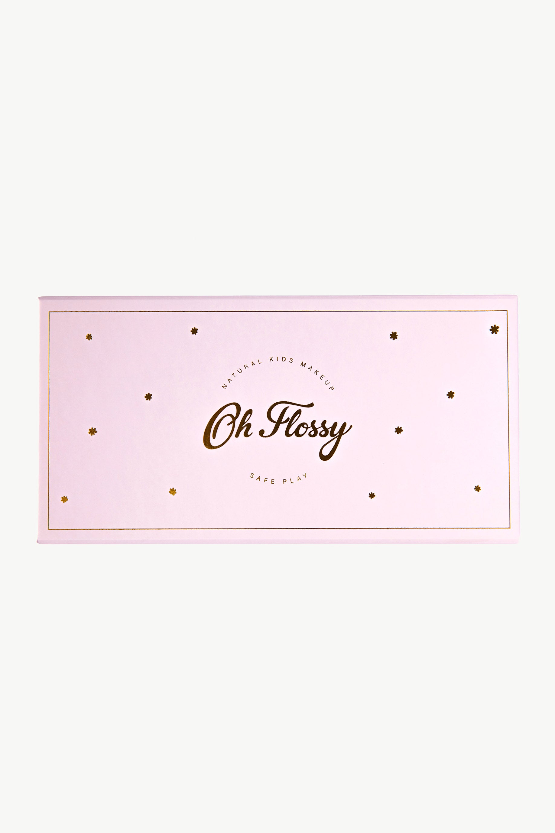 A pink, rectangular box features "Oh Flossy" in gold lettering at the center, surrounded by small gold stars. The phrases "Natural Kids Makeup" and "Non-Toxic Play" describe this safe makeup set for kids by OH FLOSSY.