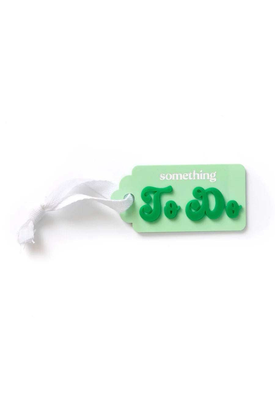 A "Something TO DO Tag Greens" by HELLO KIT CO features a playful, green typography on an acrylic tag with a white ribbon.