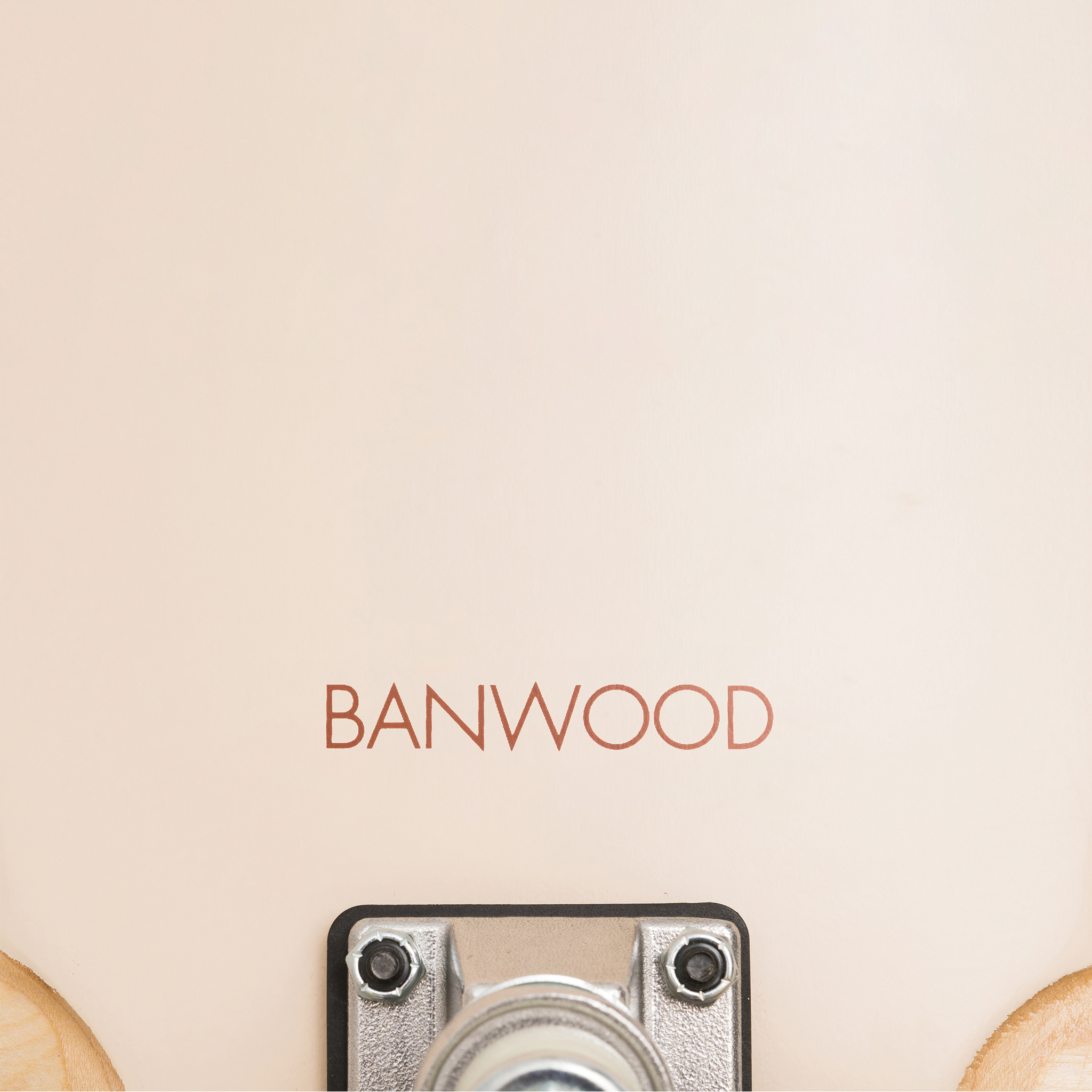 Close-up of the Banwood - Skateboard Cream shows the "BANWOOD" branding above a metallic bracket with wooden edges, similar to Canadian Maple decks or high rebound wheels.