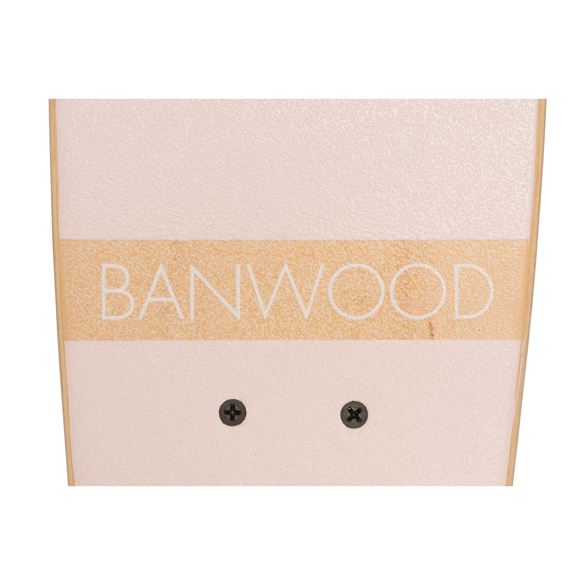 Close-up of a Banwood - Skateboard Pink against a pale pink background, showcasing "BANWOOD" in bold on a beige strip with black screws. This piece embodies the quality and style of Canadian Maple craftsmanship.