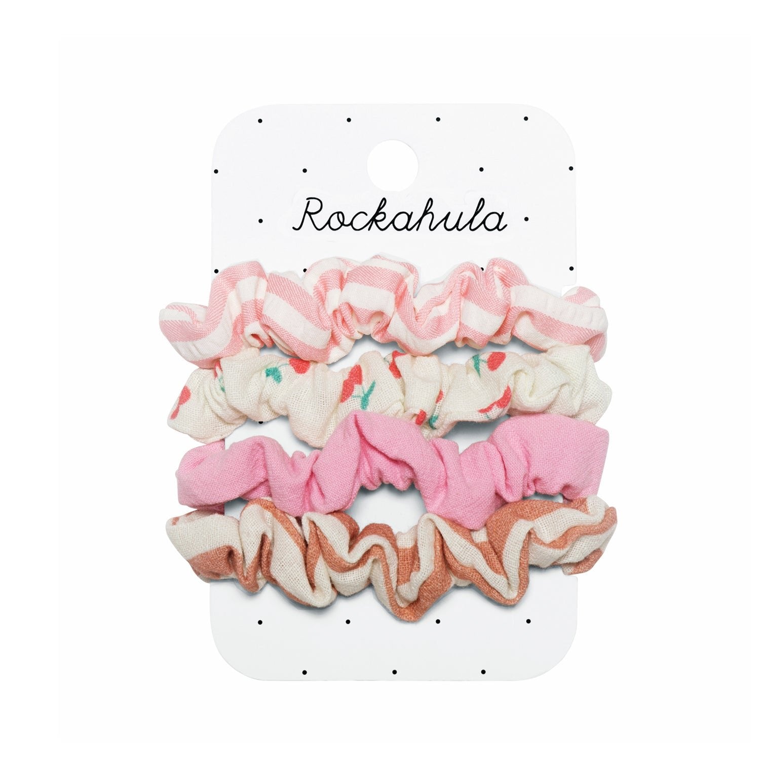 The Rockahula - Cherry Stripe Scrunchie Set by ROCKAHULA includes four scrunchies in pink, white, and brown patterns—featuring cherry prints—displayed on a white Rockahula card with small black dots.